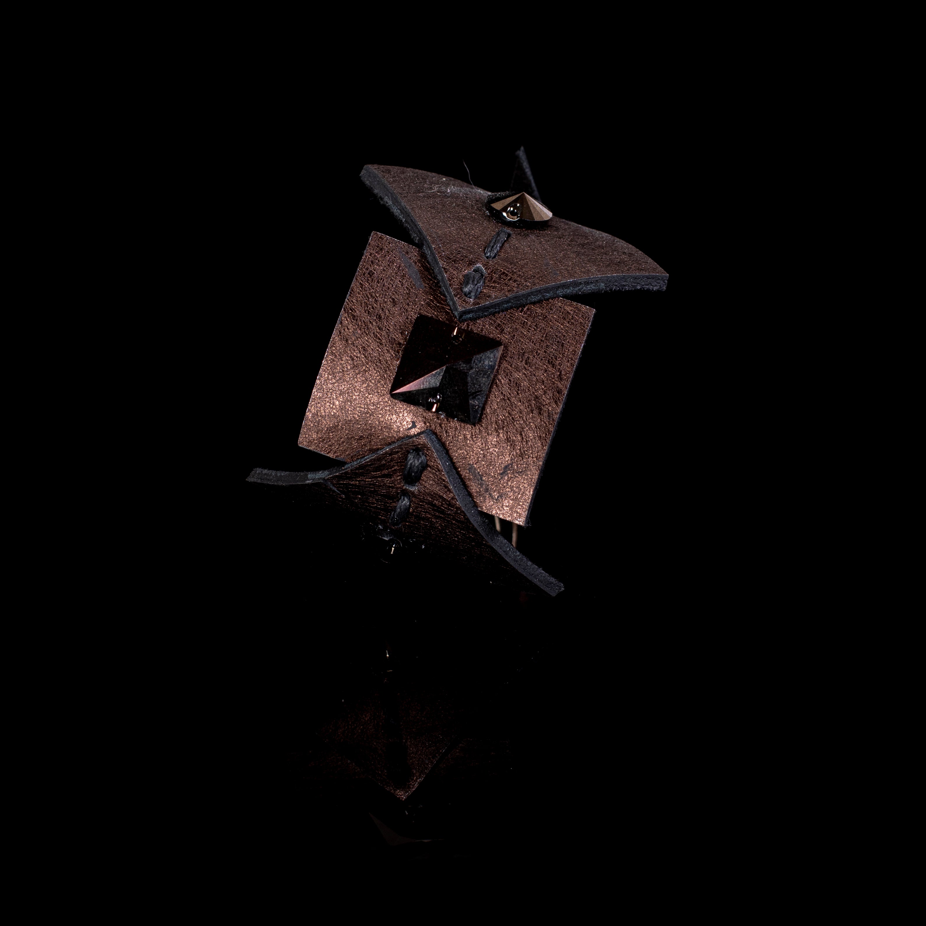 Brown leather sculptural cuff bracelet with layered panels and pyramid stud detail, handcrafted avant-garde statement bracelet for women by THE DARK