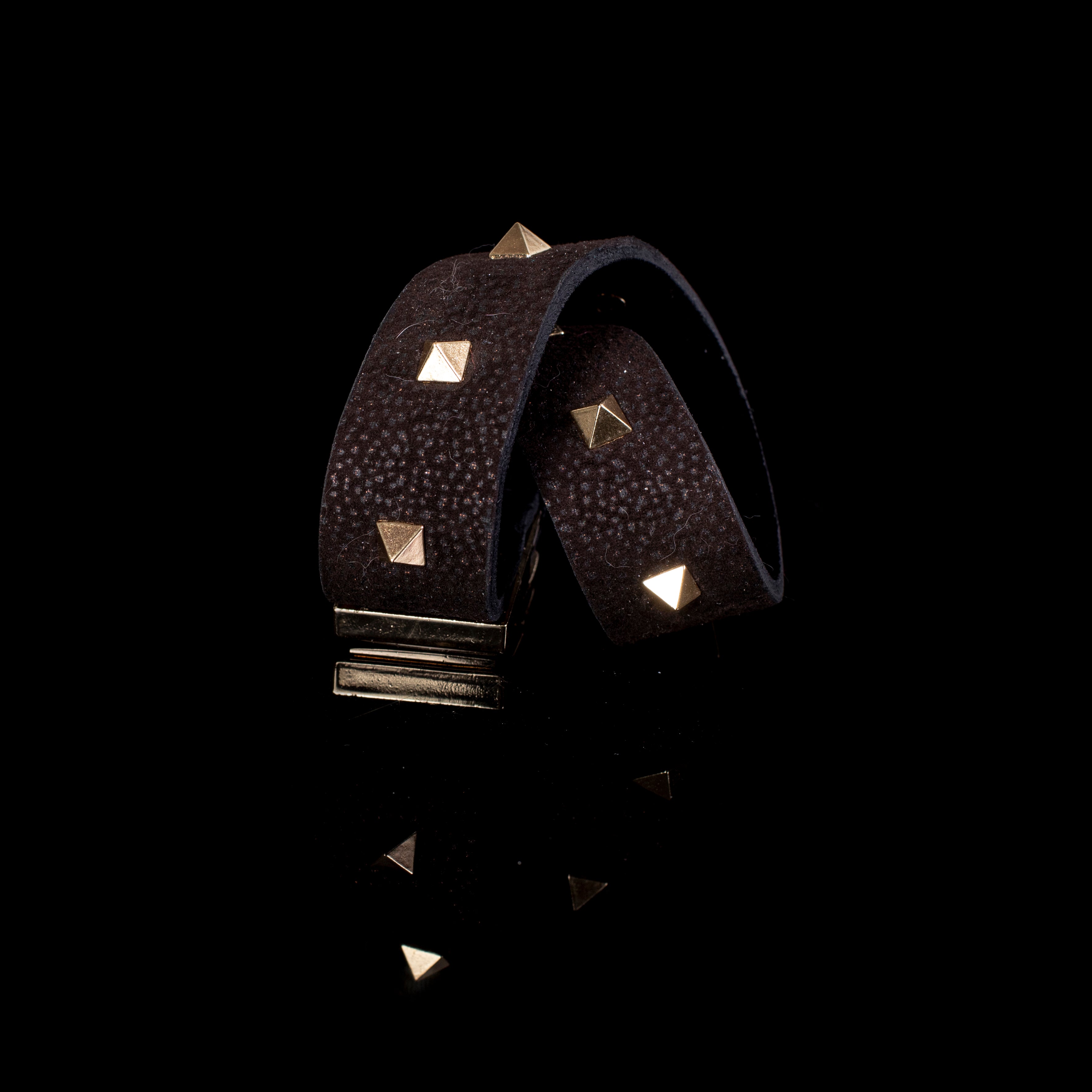 Black textured leather cuff bracelet with gold clasp and pyramid studs, handcrafted wide statement bracelet for women
