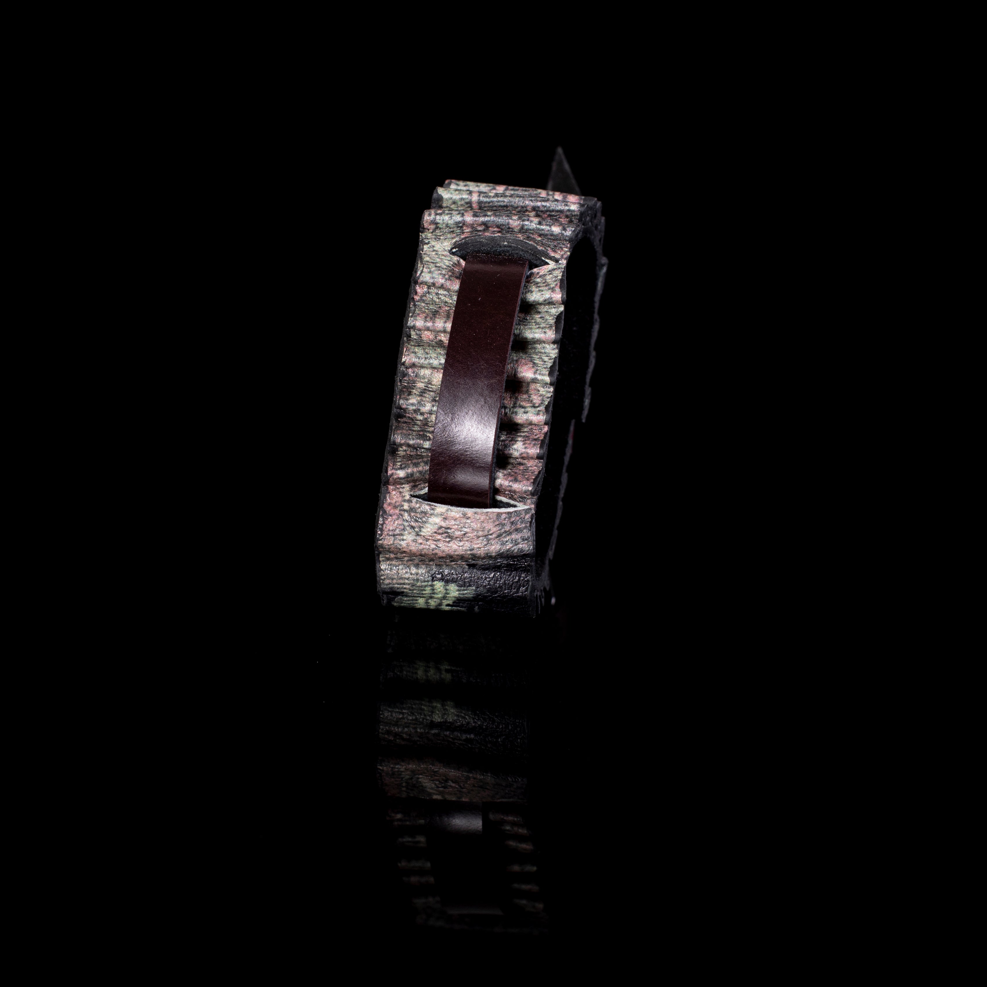 Textured multicolor pleated leather cuff bracelet with central brown strap, wide sculptural statement bracelet for women