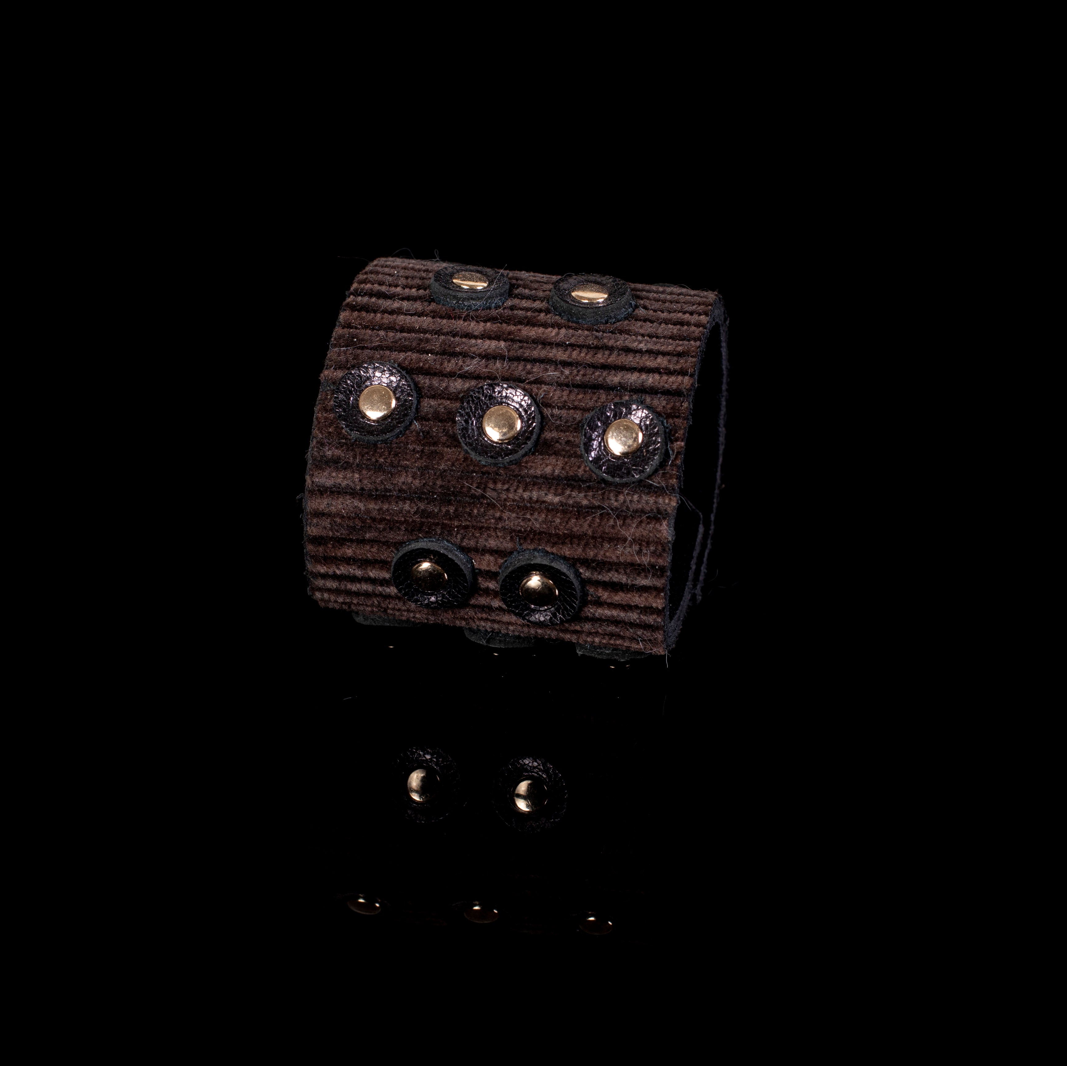 Brown ribbed leather wide cuff bracelet with multiple gold stud accents, handcrafted textured statement piece for women
