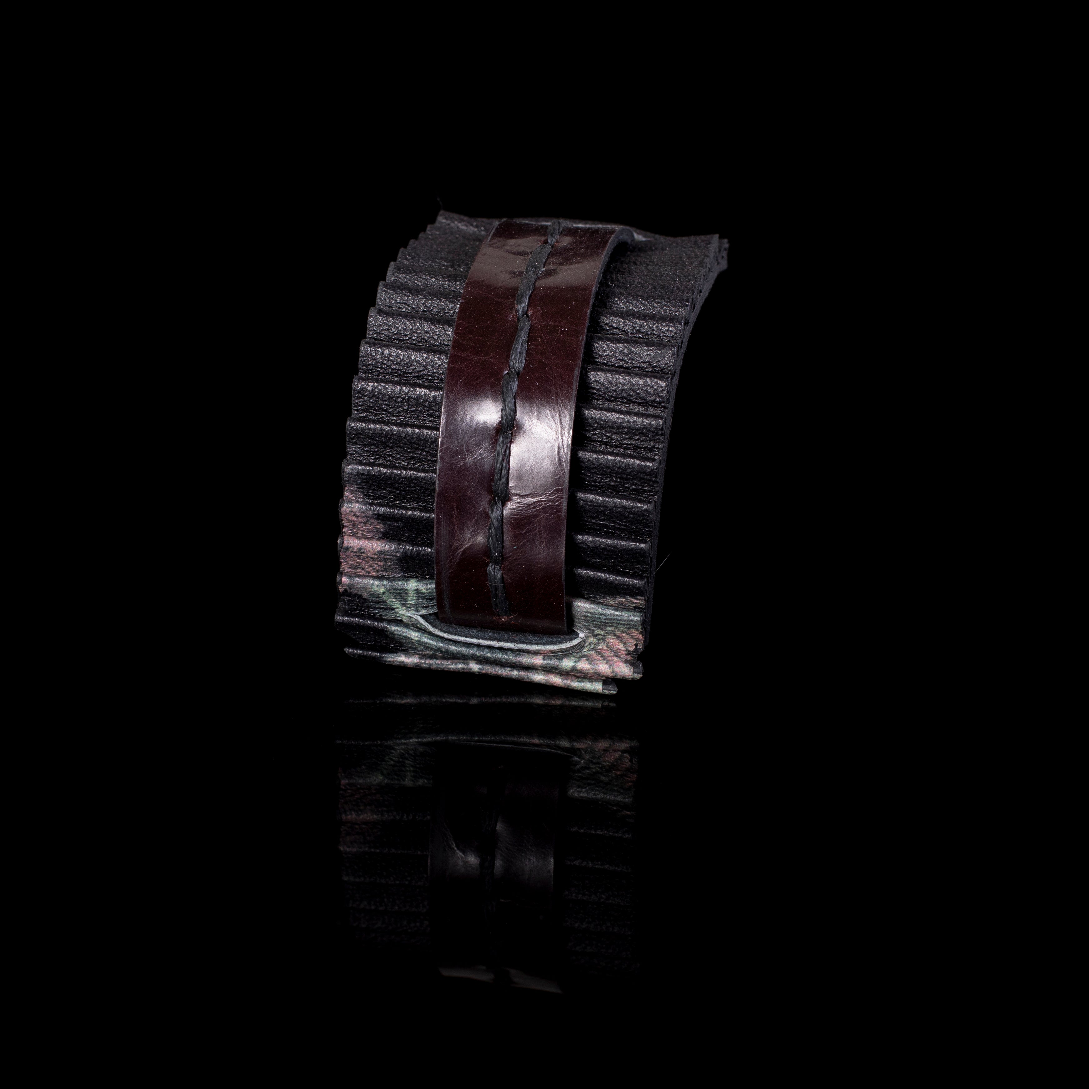 Black pleated leather cuff bracelet with central stitched strap, wide textured statement bracelet for women