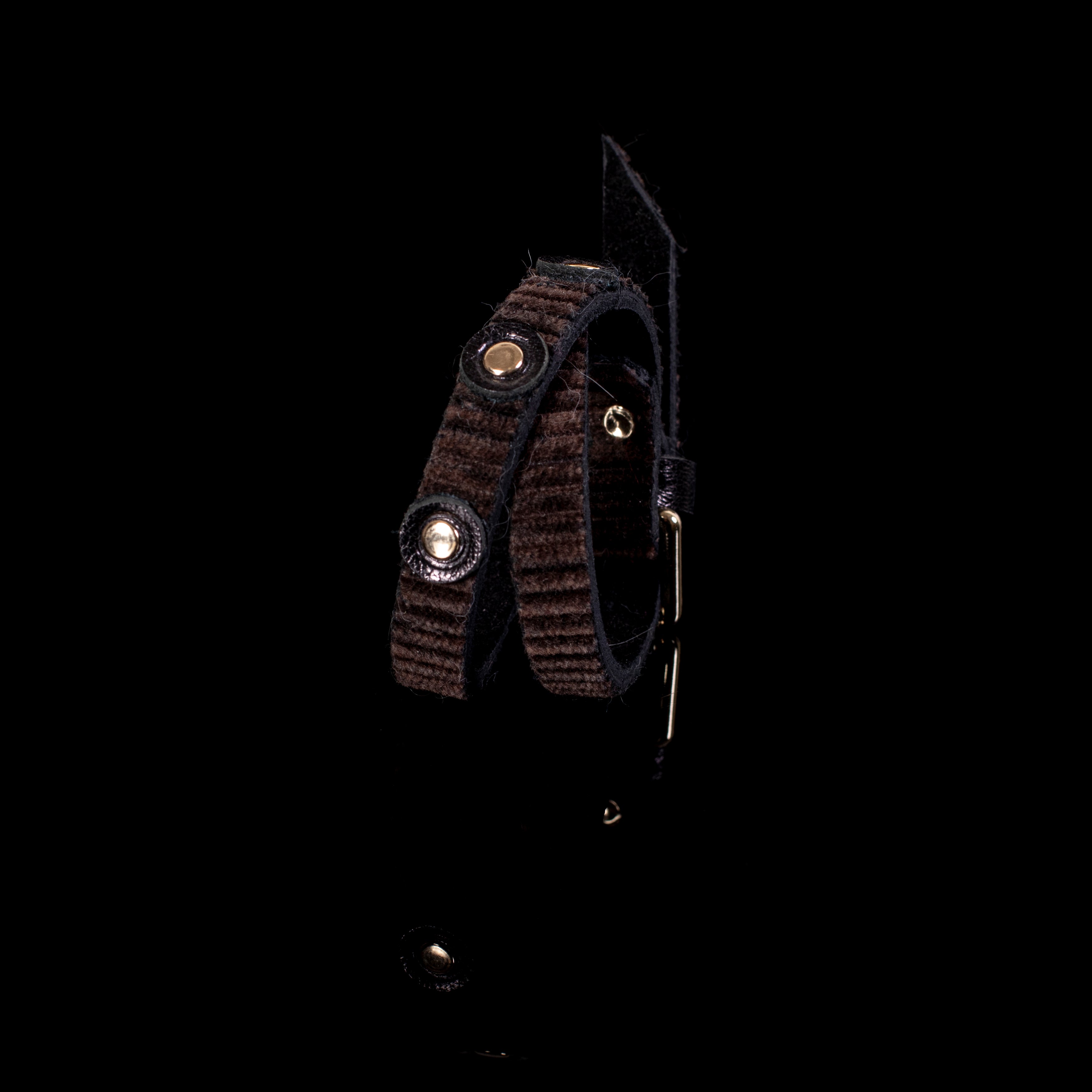 Brown double strap leather bracelet with ribbed texture and gold stud accents, handcrafted layered design for women
