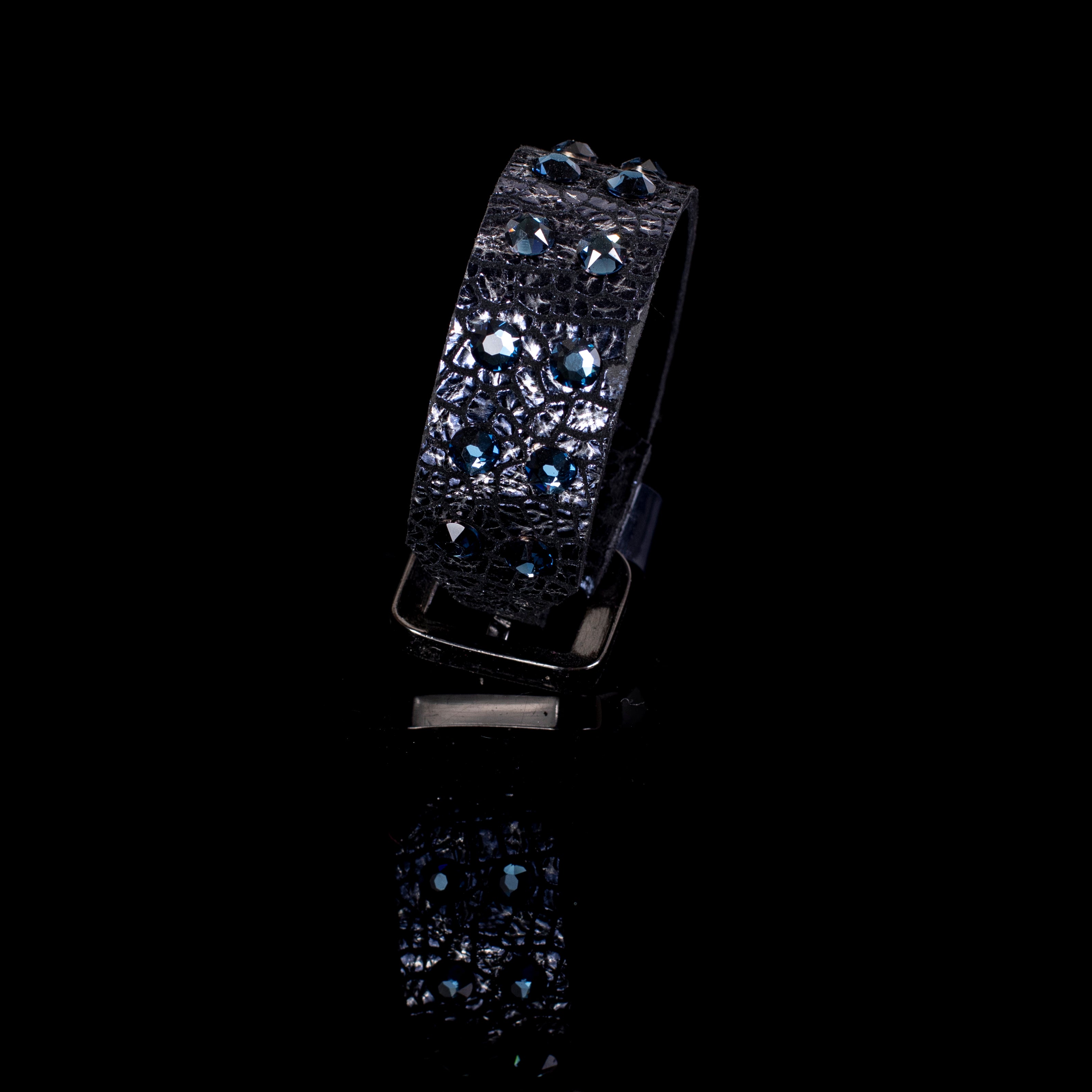 Black python leather cuff bracelet with blue round crystals on textured surface, handcrafted wide statement bracelet for women by THE DARK