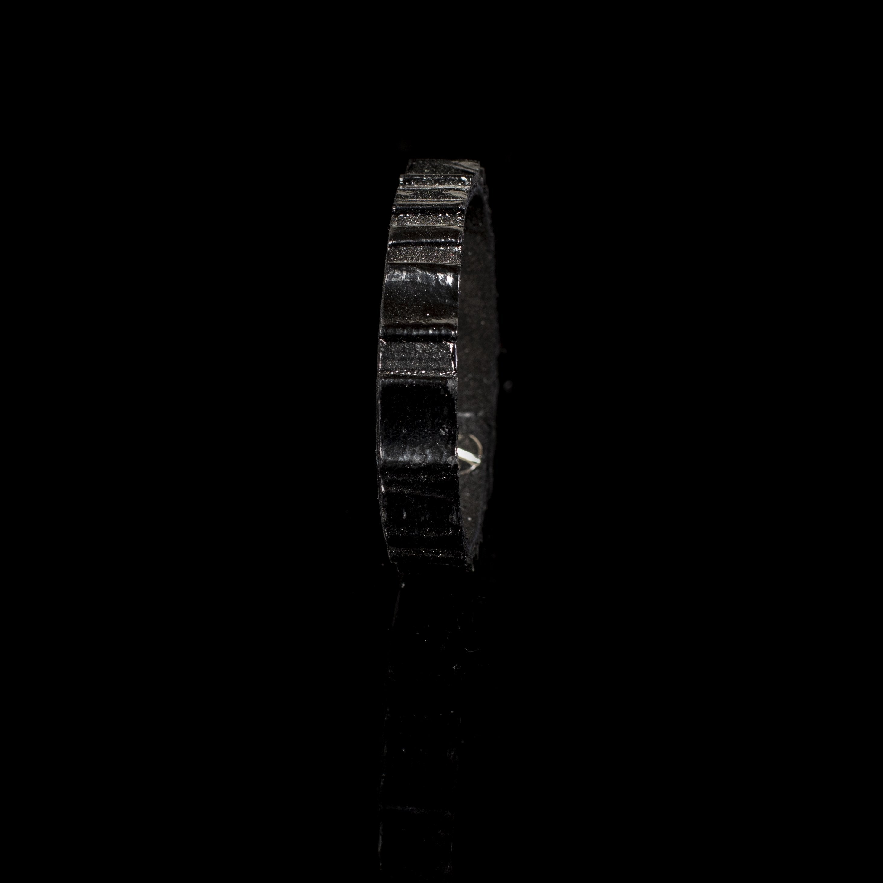 Handmade black crocodile embossed leather bracelet with textured reptile pattern and minimalist cuff design.