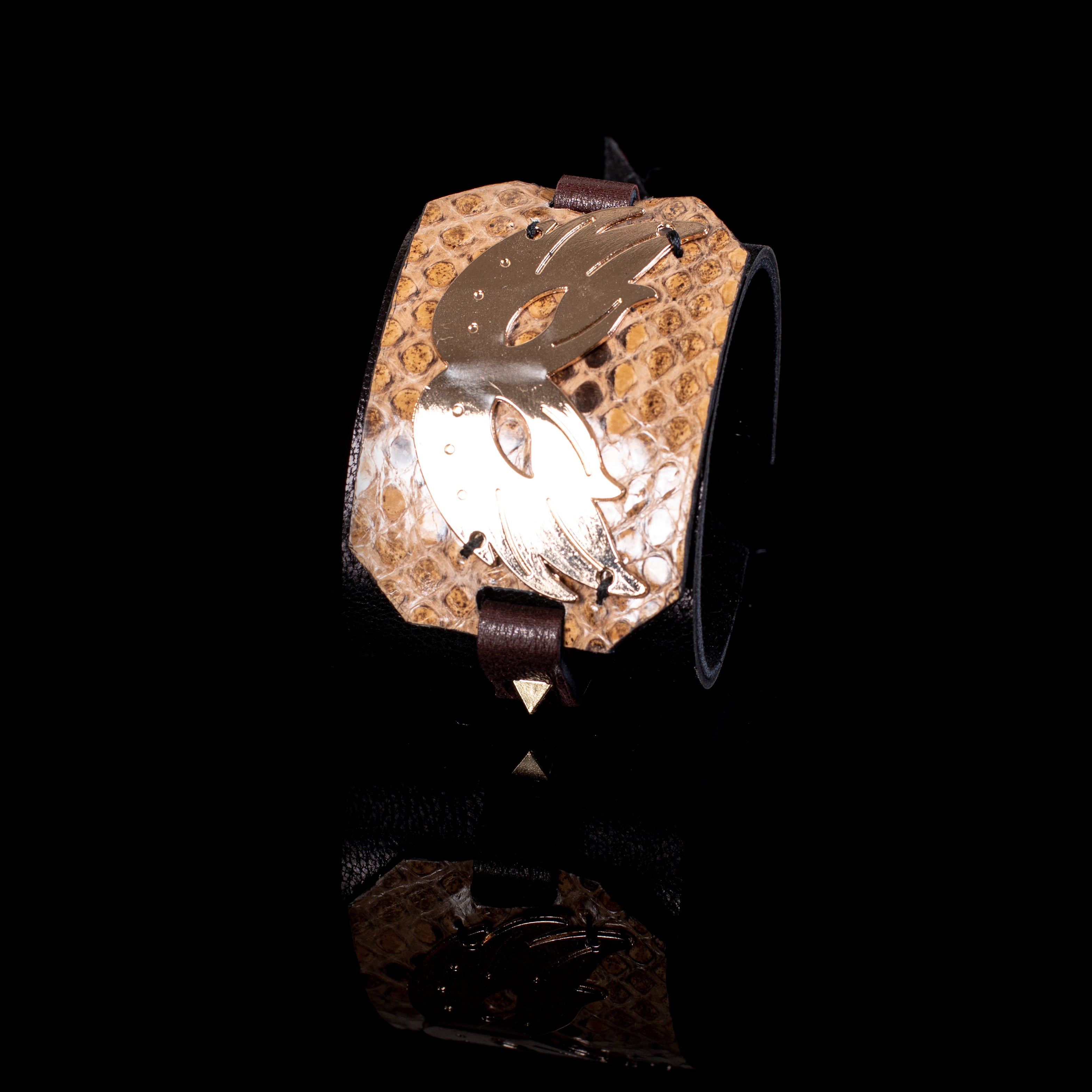 wide python leather cuff bracelet with sculptural gold plate centerpiece bold statement design