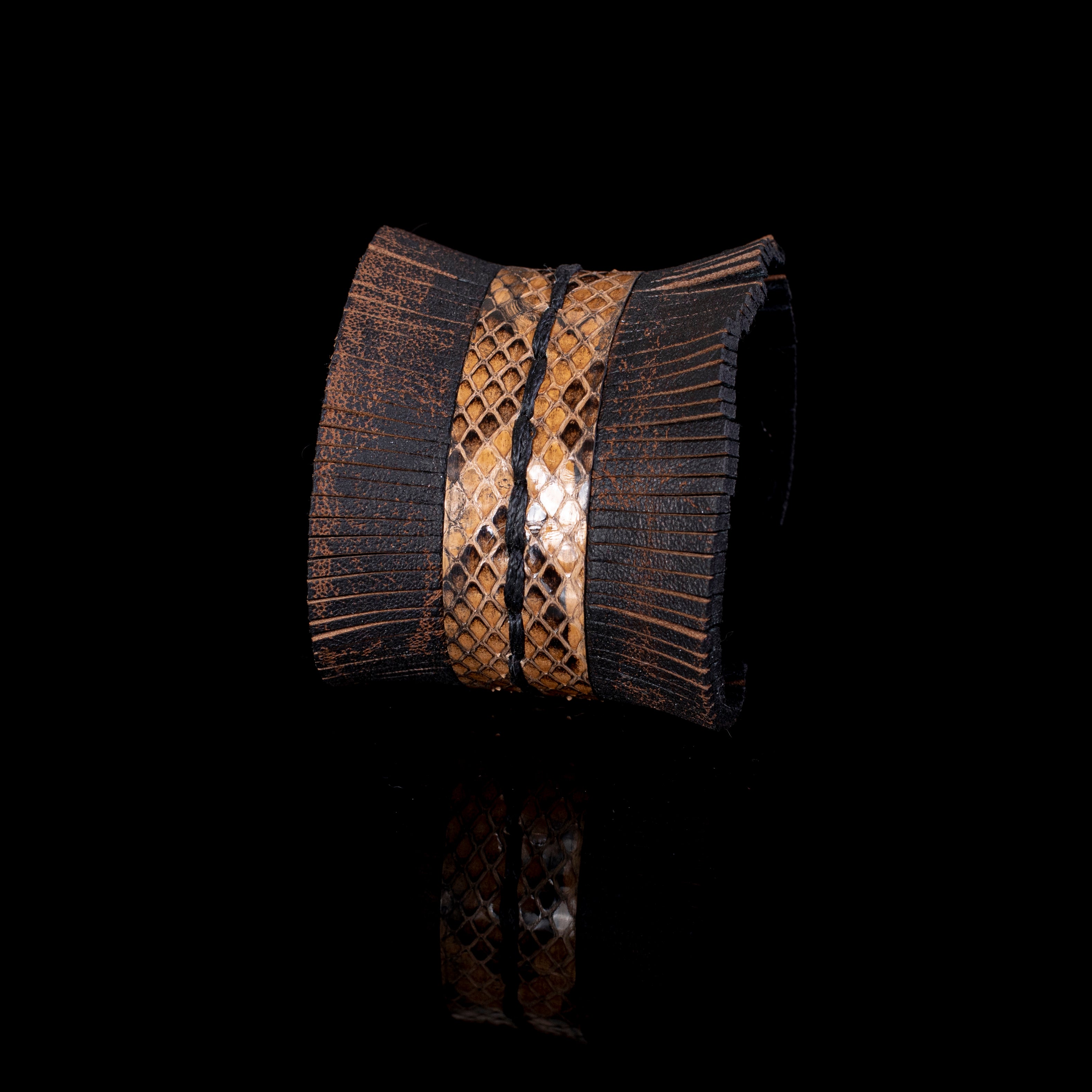 Brown leather wide cuff bracelet with central python textured panel, fringe edges and hand stitching, handcrafted statement bracelet for women by THE DARK