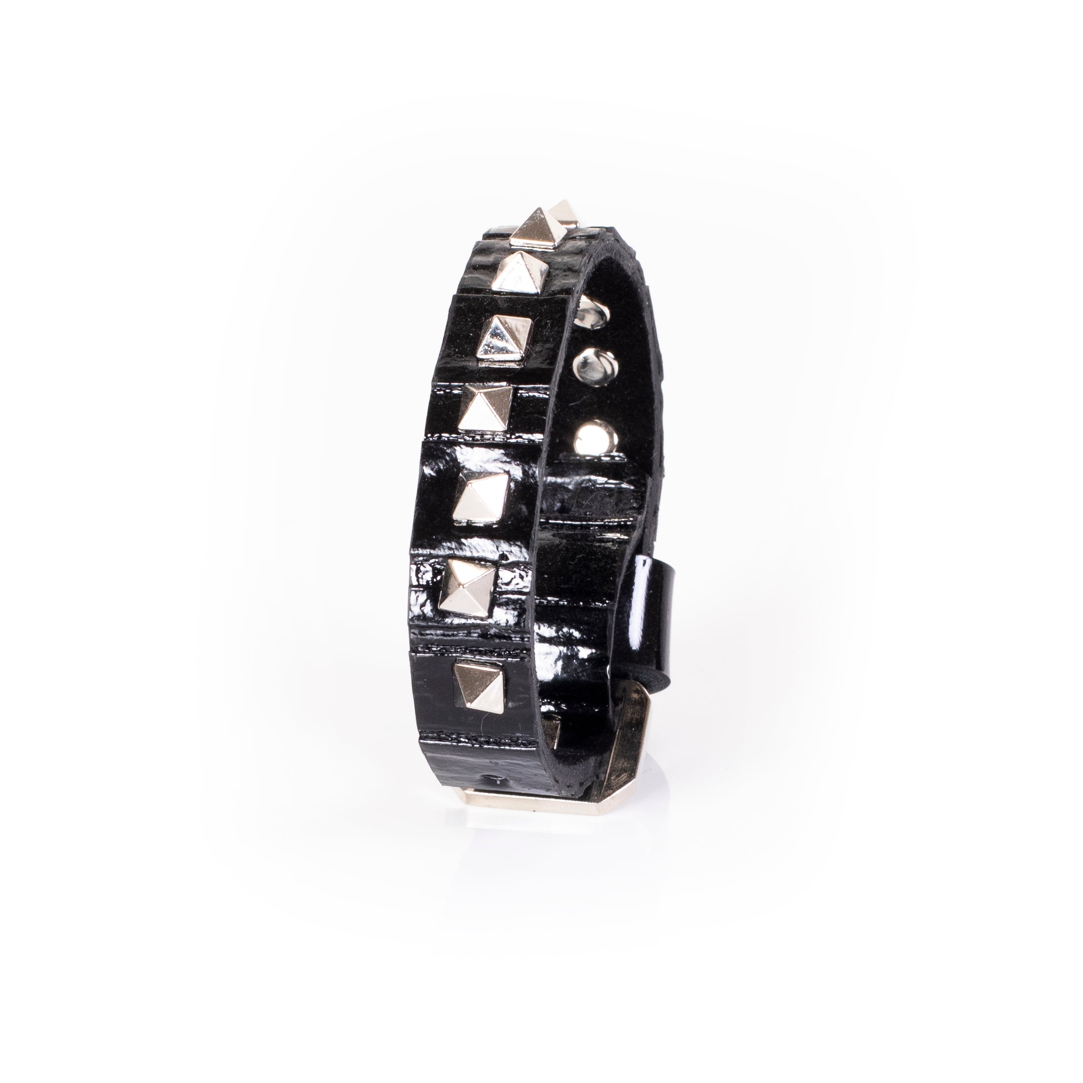 Black patent leather slim cuff bracelet with silver pyramid studs in vertical alignment, handcrafted statement bracelet for women by THE DARK