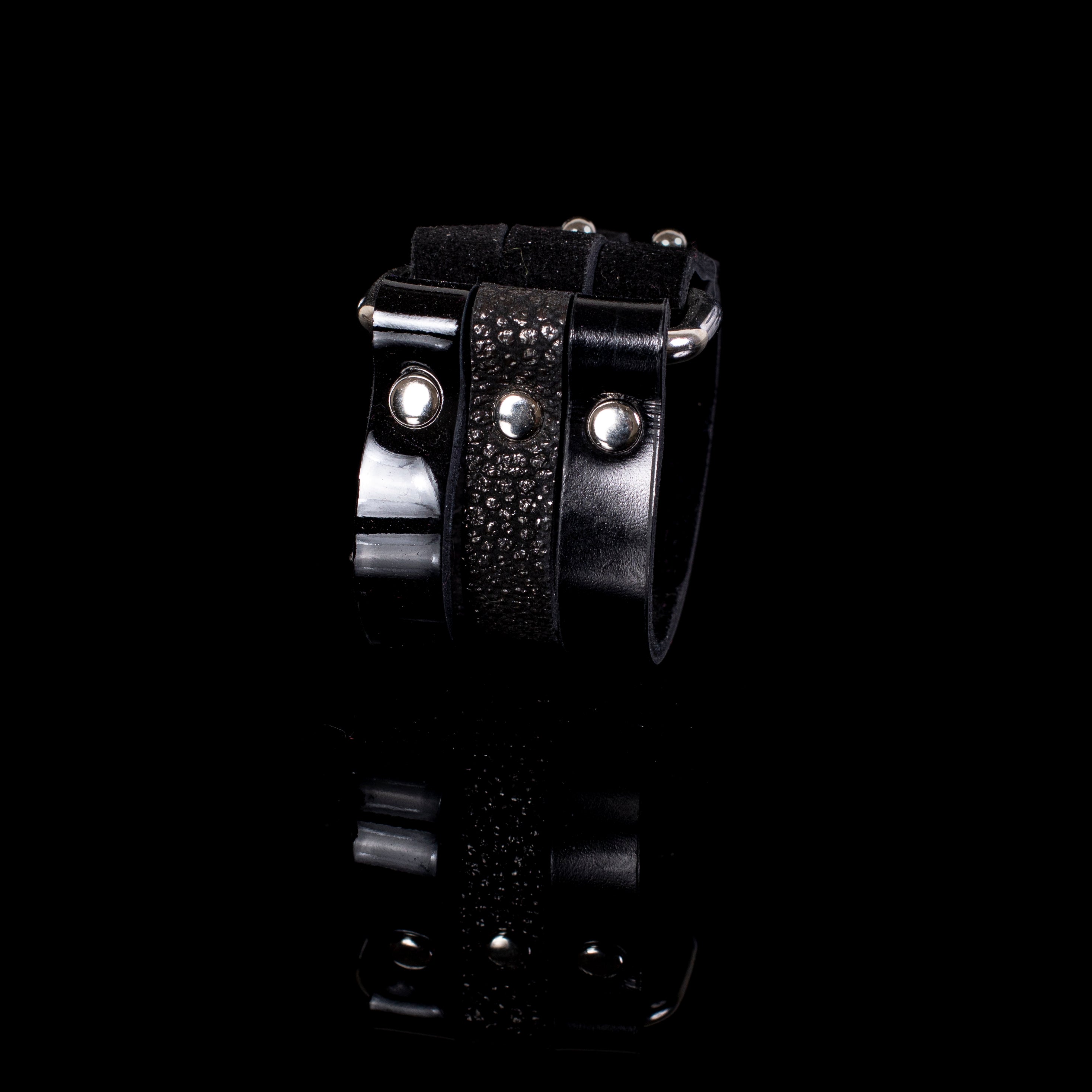 Black leather multi-strap cuff bracelet with suede panels, metal studs and ring detail, handcrafted layered statement bracelet for women by THE DARK