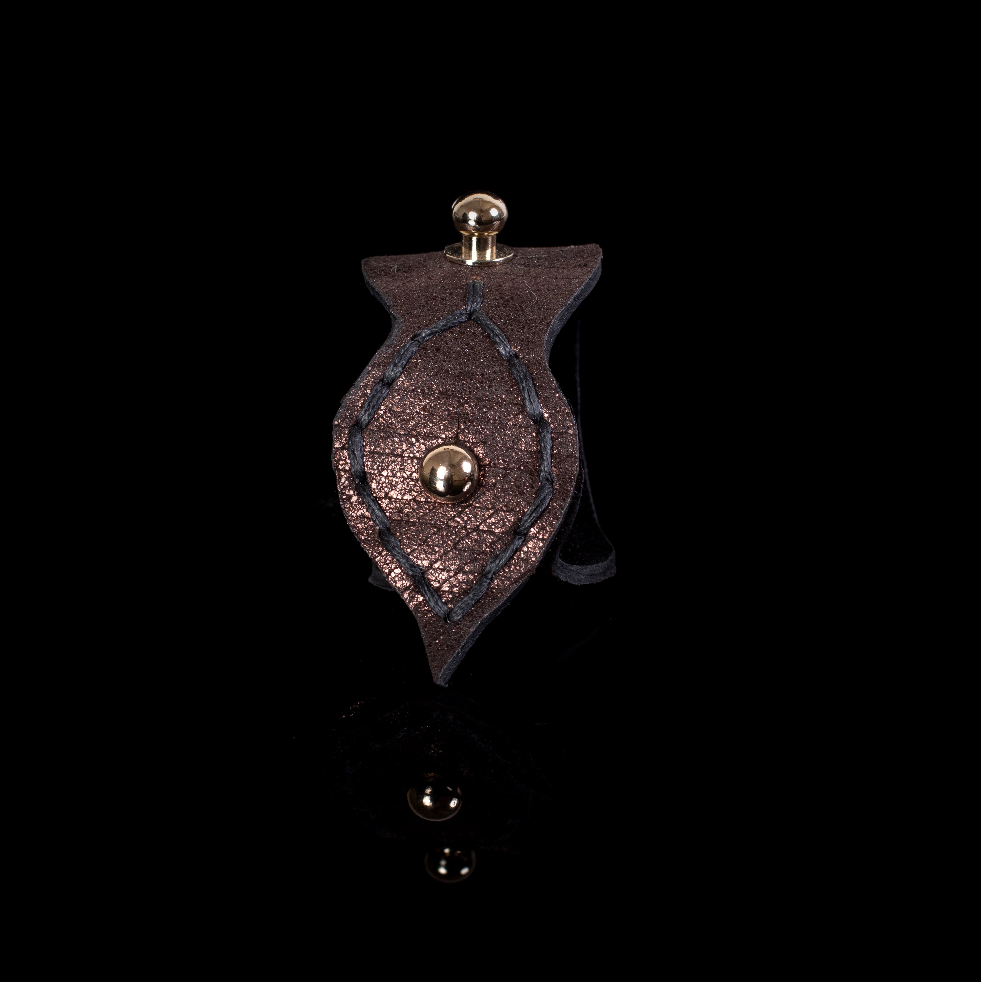 Metallic brown leather cuff bracelet with leaf-shaped flap and gold stud, handcrafted statement bracelet for women