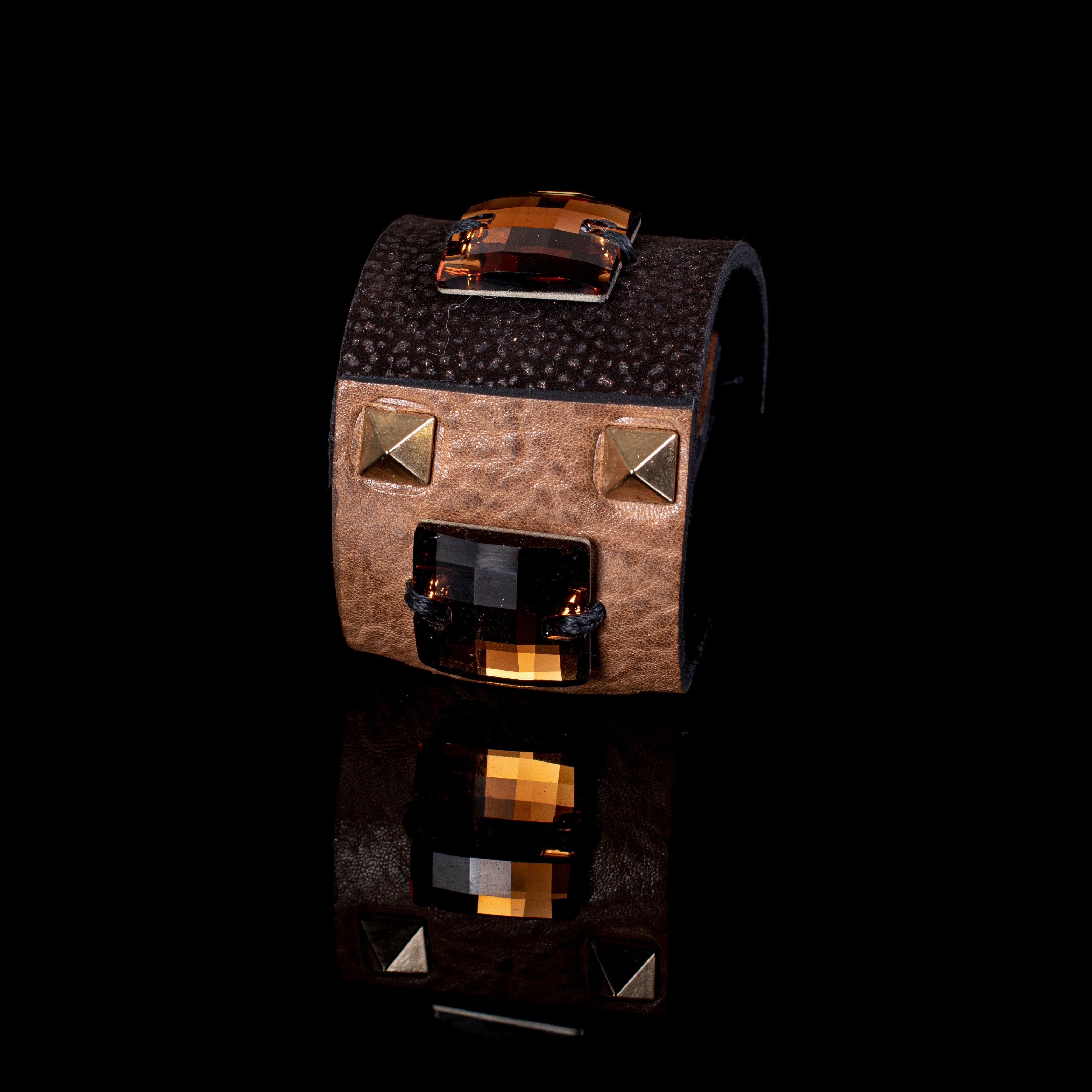 Brown leather cuff bracelet with two amber crystal stones and gold stud accents, wide handcrafted statement piece