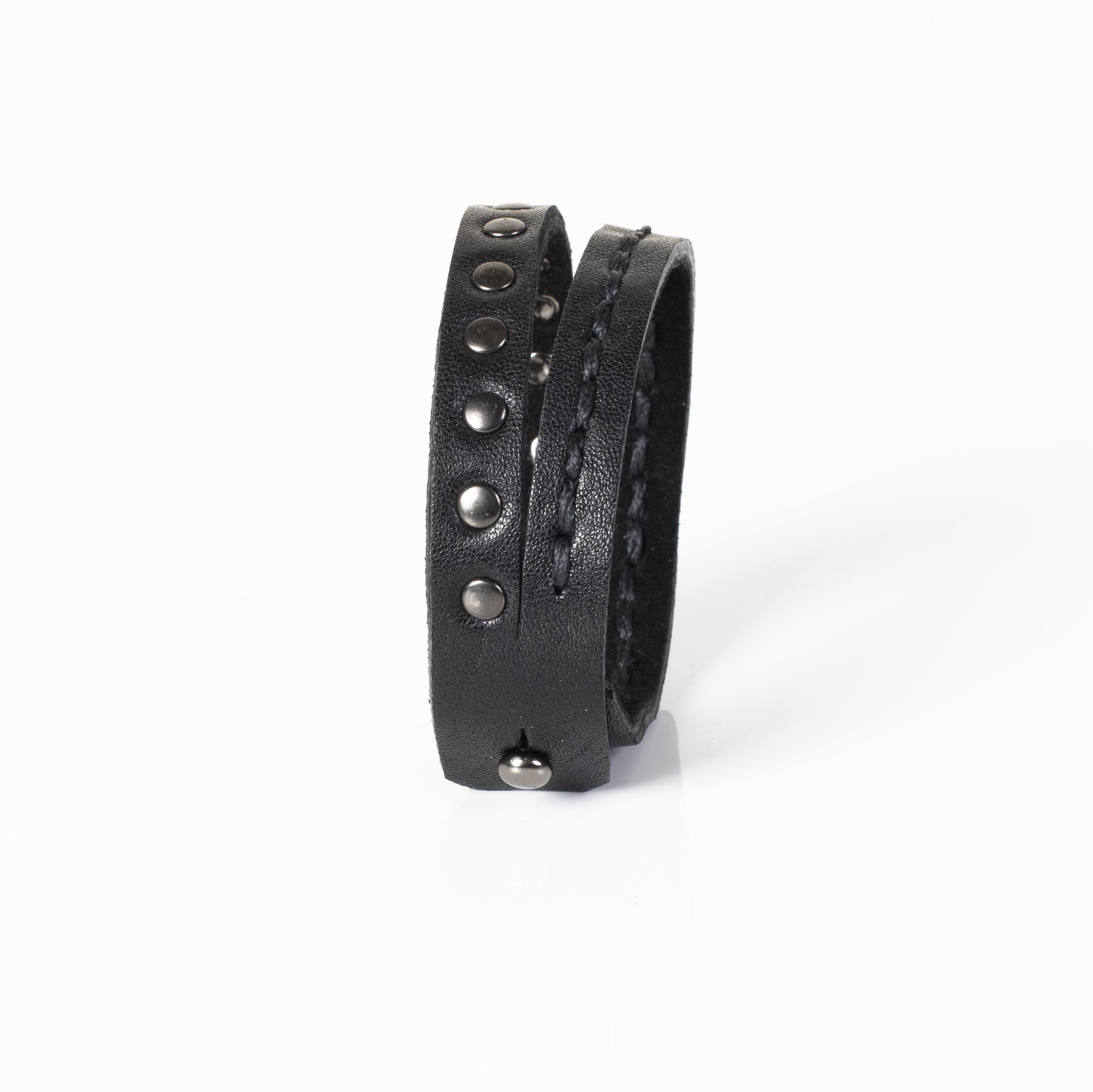 Men's double-wrap black genuine leather bracelet featuring hand-stitched detailing and gunmetal stud accents on a white background.