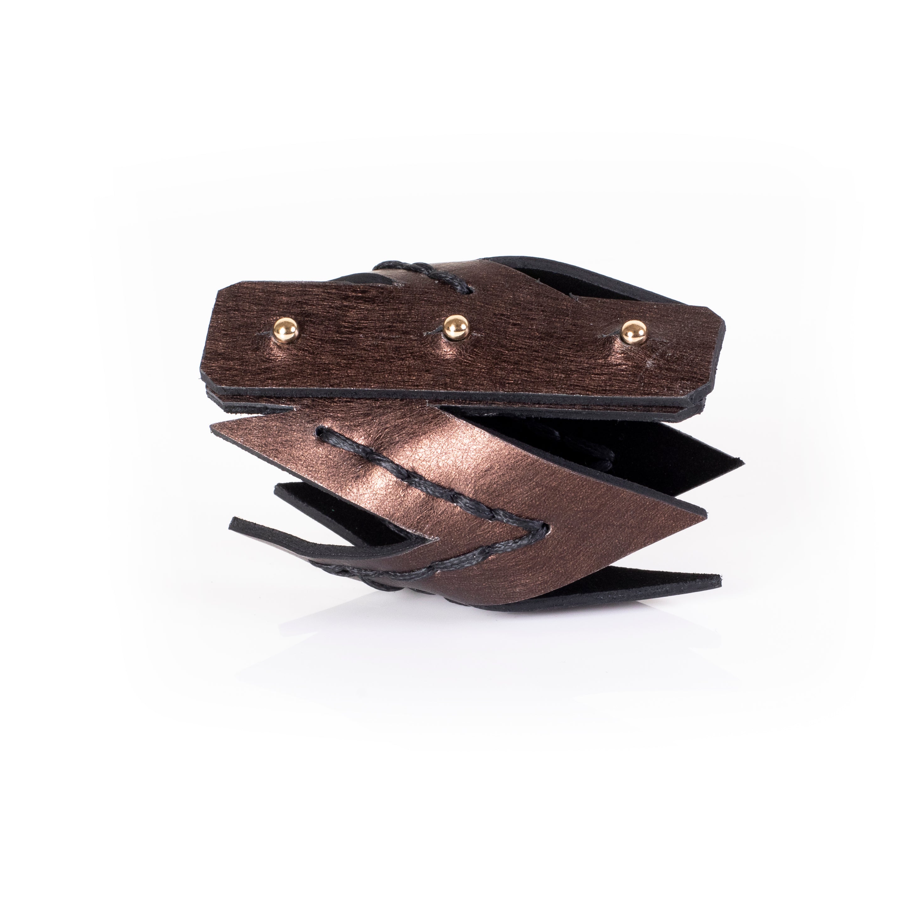 Brown leather zigzag cuff bracelet with layered angular panels and hand-stitched detailing, avant-garde statement piece for women