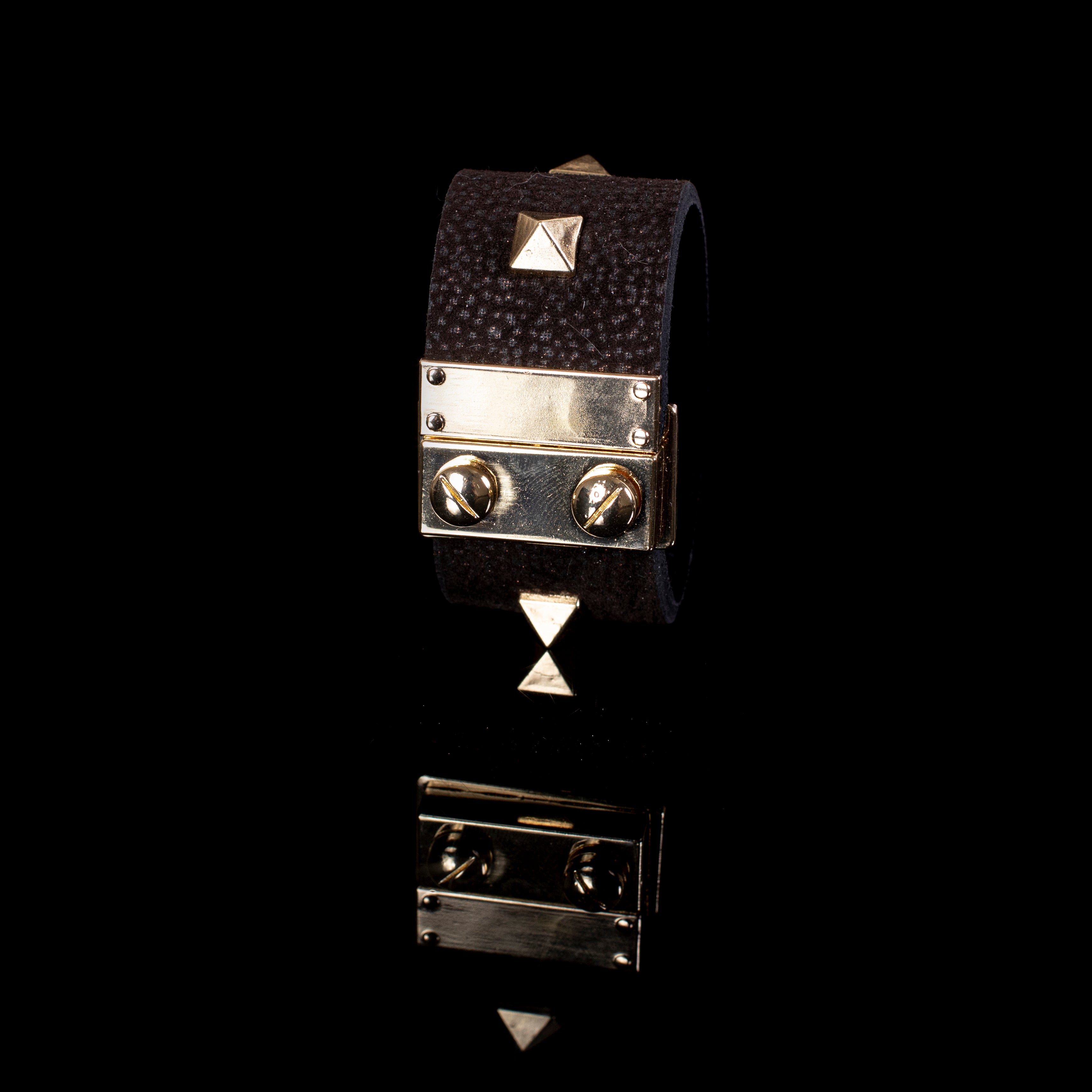 Black textured leather cuff bracelet with gold plate detail and pyramid studs, handcrafted wide statement bracelet for women