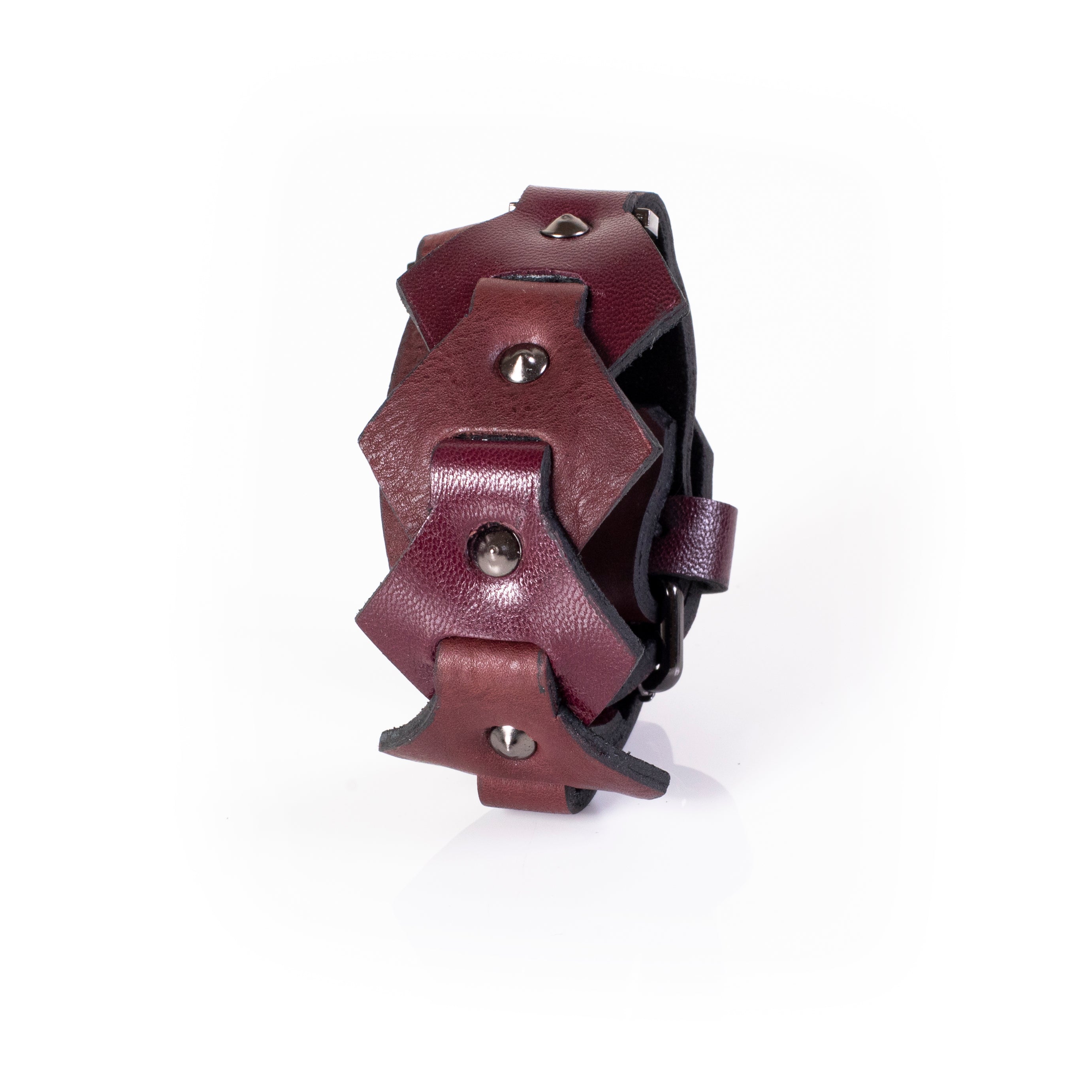 Burgundy leather cuff bracelet with layered geometric panels and metal studs, handcrafted wide statement bracelet for women
