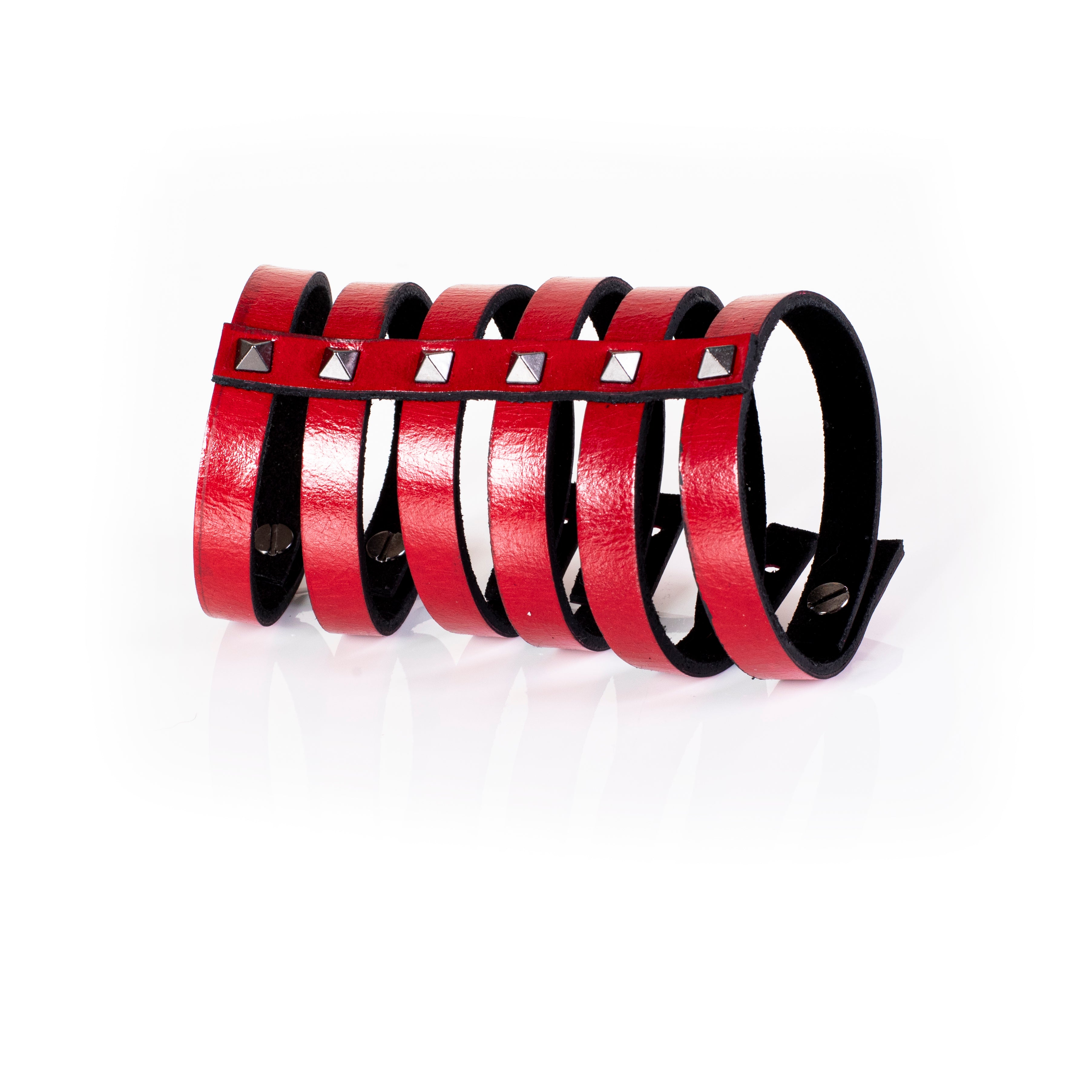 Red leather multi-strap cuff bracelet with silver pyramid studs and black interior lining, handcrafted structured statement bracelet for women by THE DARK
