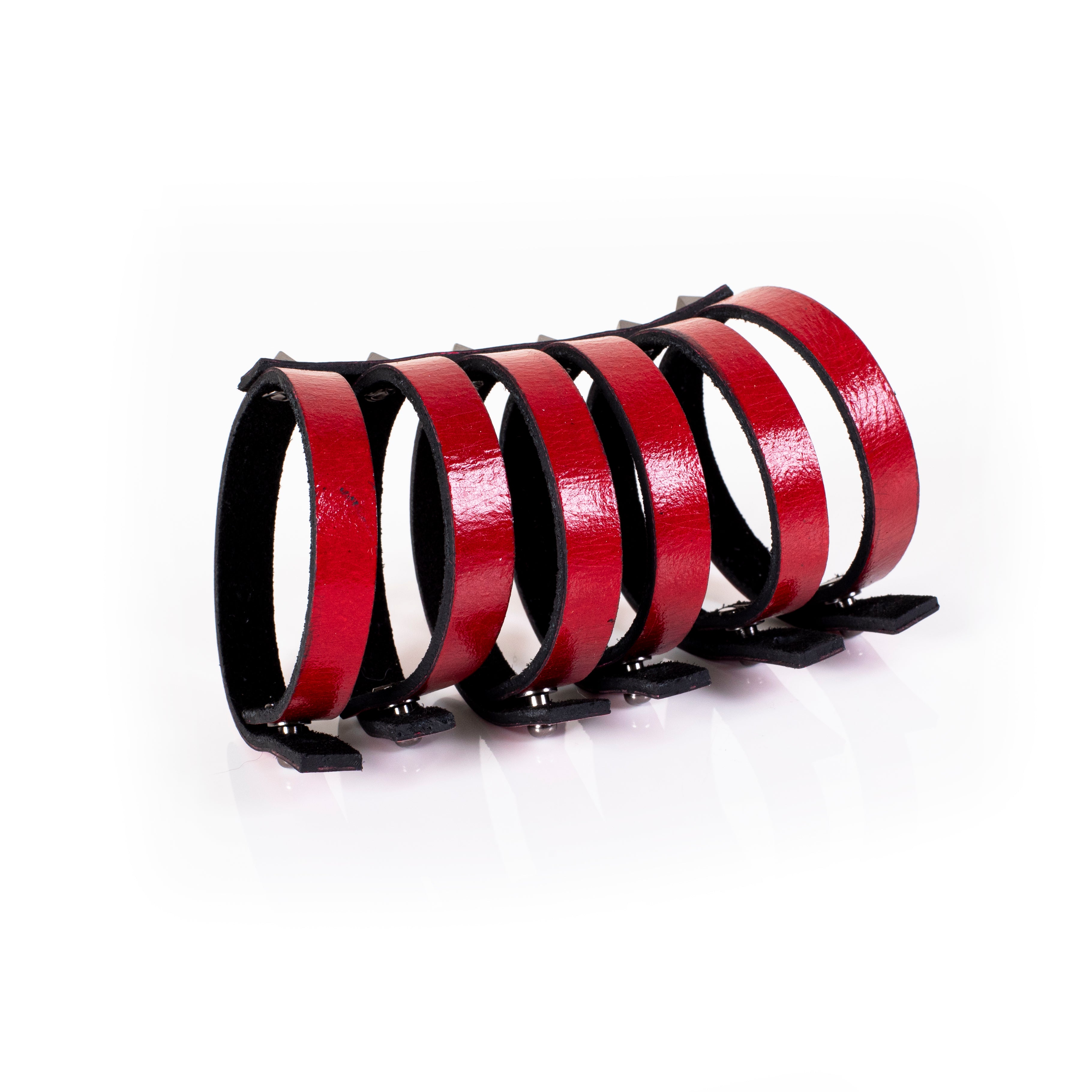 Red leather multi-strap cuff bracelet with silver pyramid studs and black interior lining, handcrafted structured statement bracelet for women by THE DARK