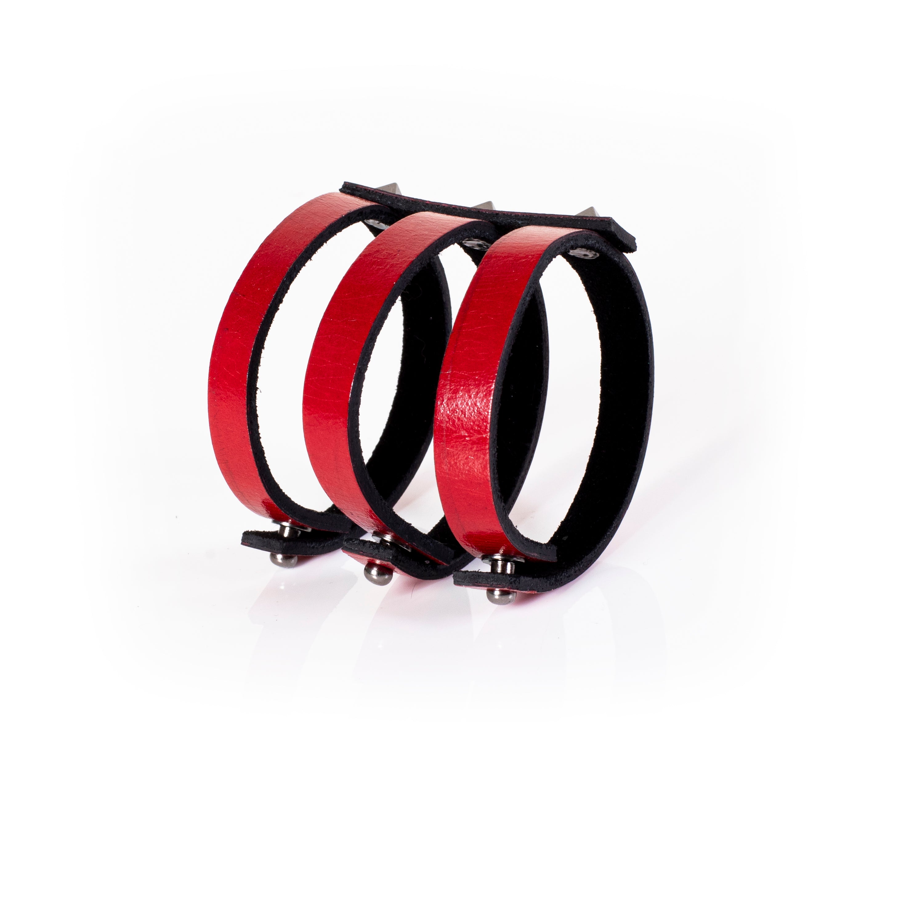 Red leather triple strap cuff bracelet with silver pyramid studs and black interior lining, handcrafted structured bracelet for women by THE DARK