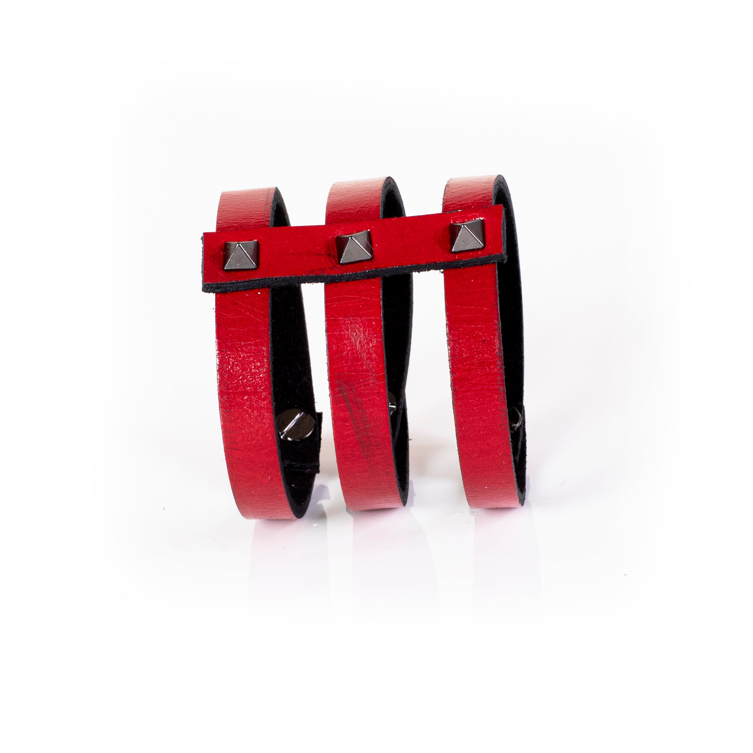Red leather triple strap cuff bracelet with silver pyramid studs and black interior lining, handcrafted structured bracelet for women by THE DARK