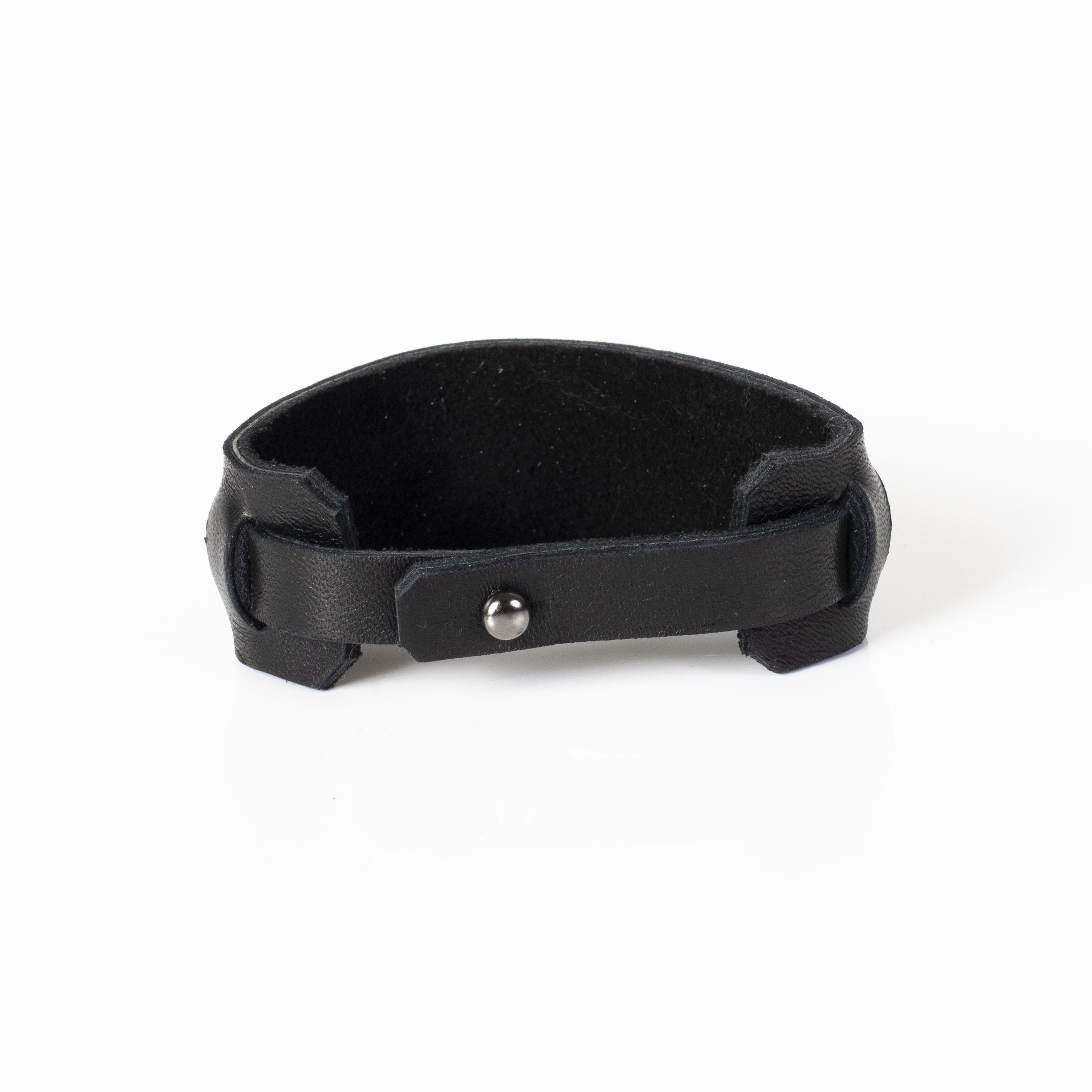 Handmade black leather cuff bracelet featuring an industrial buckle design and textured black mesh detail for men.
