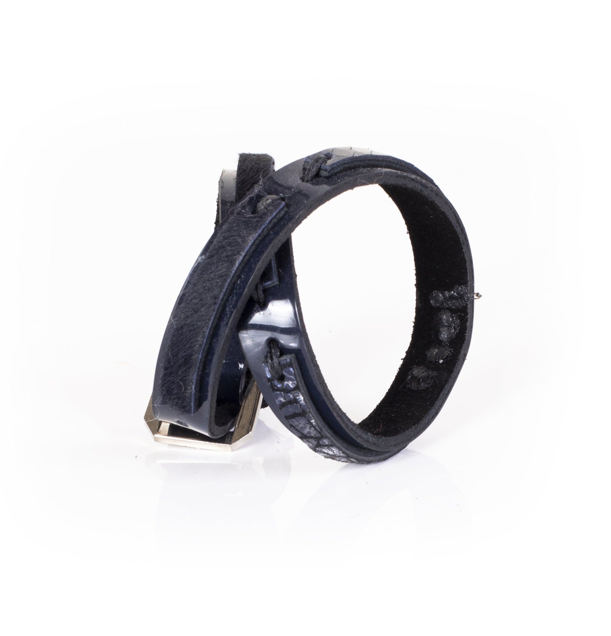 Black leather sculptural cuff bracelet with layered construction and minimal architectural design, handcrafted statement bracelet for women by THE DARK
