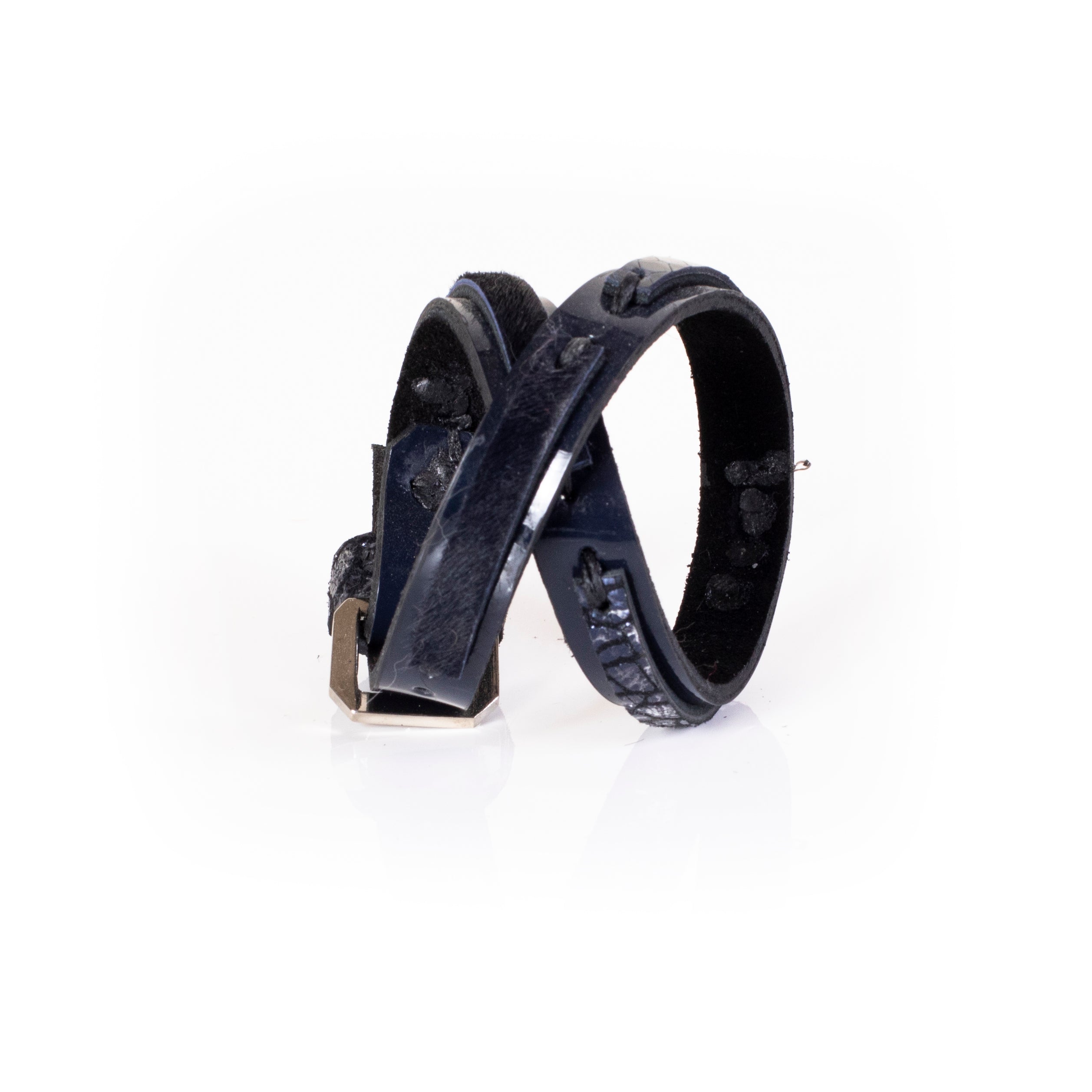 Black leather sculptural cuff bracelet with layered construction and minimal architectural design, handcrafted statement bracelet for women by THE DARK