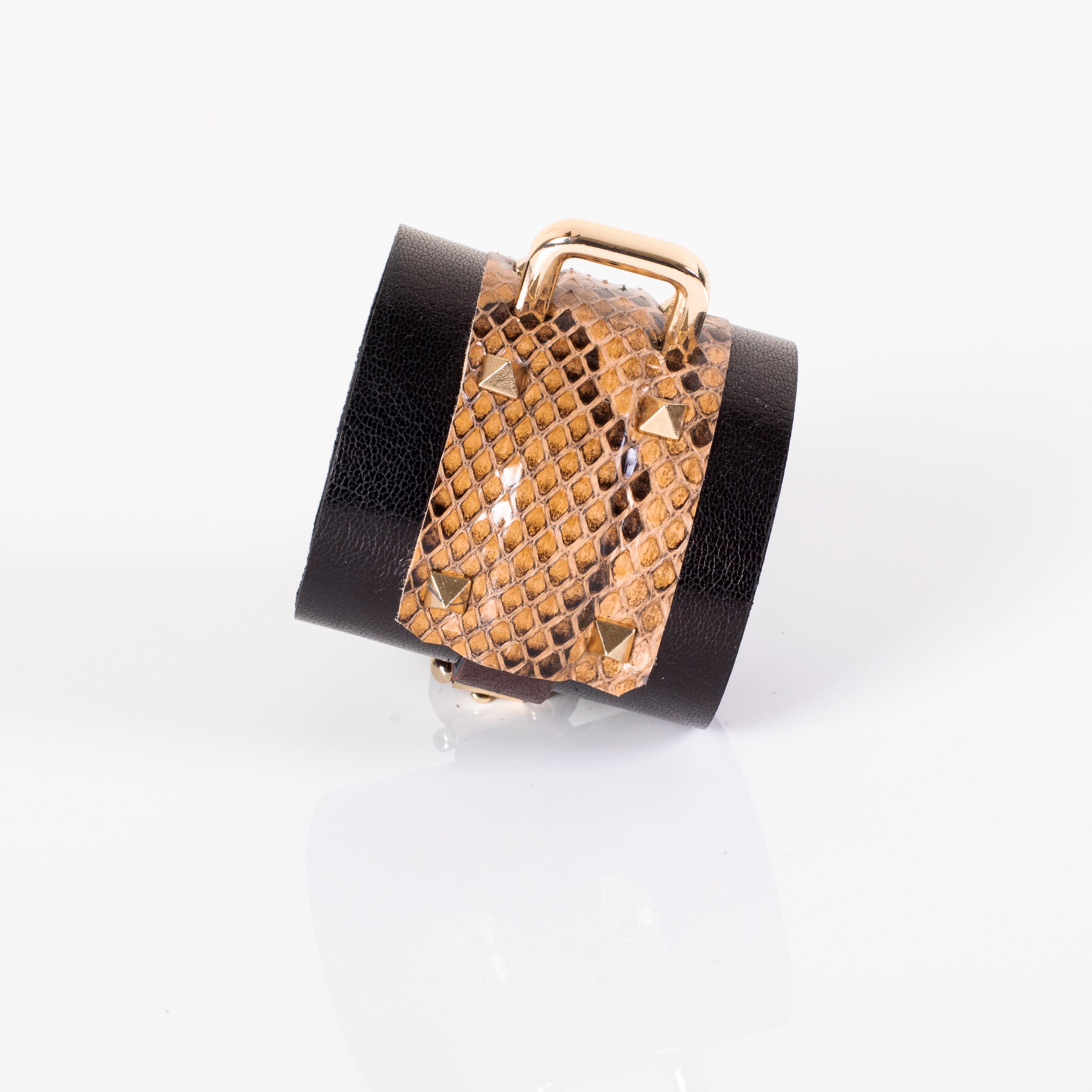 Brown python leather cuff bracelet with black wide band and gold metal bar detail, handcrafted statement wrist accessory for men