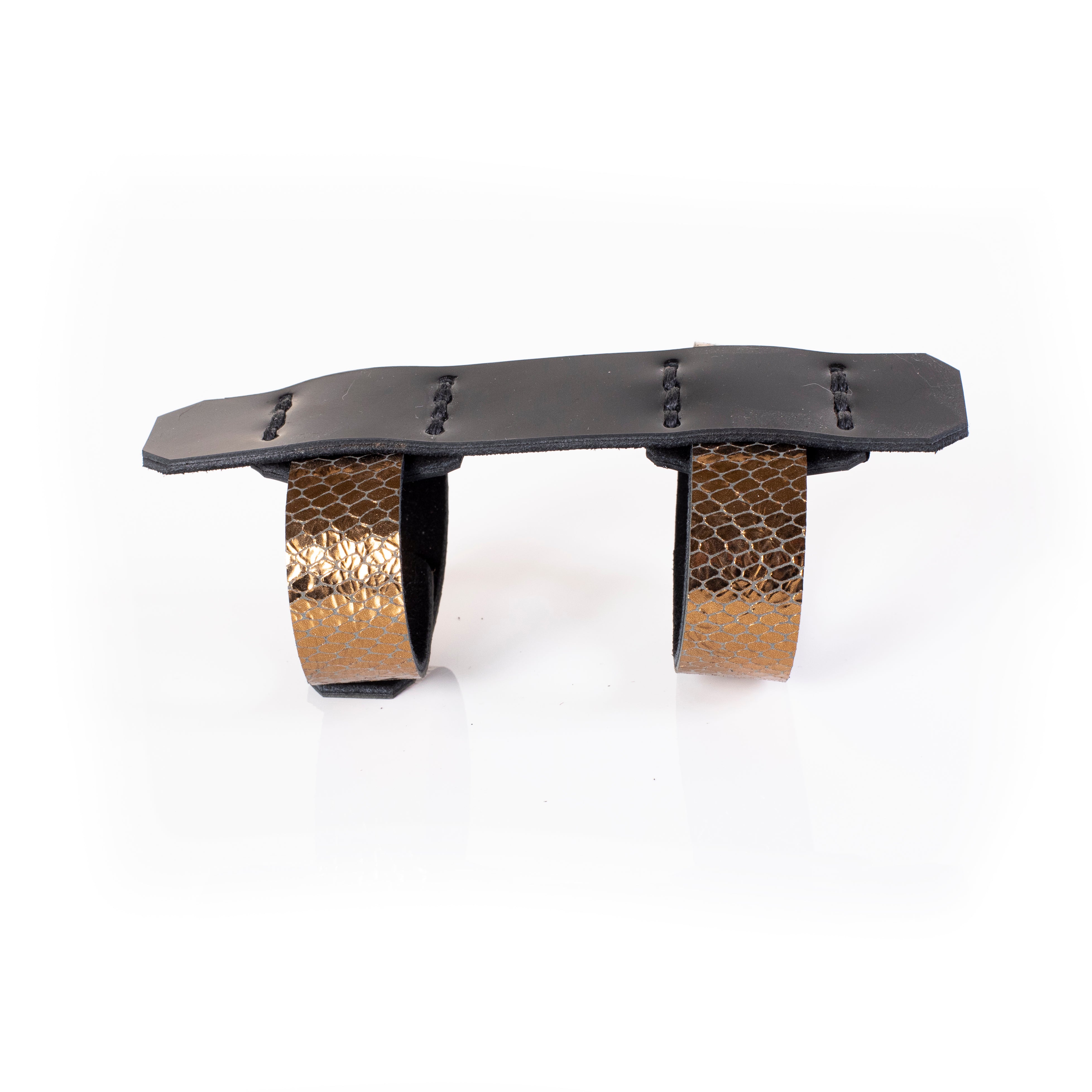 Black leather sculptural cuff bracelet with double ring design and gold python textured bands, handcrafted architectural statement bracelet for women by THE DARK