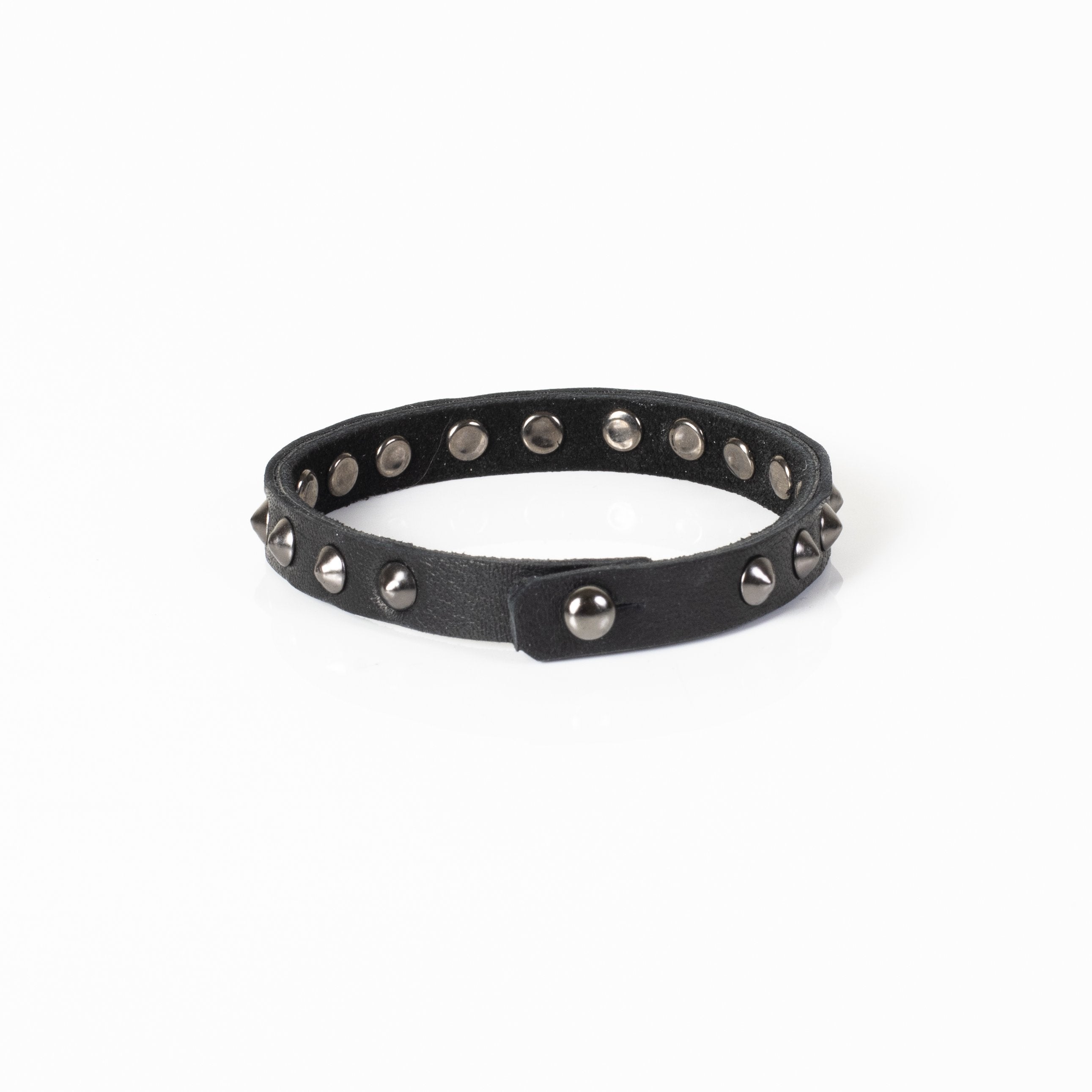 Handmade black leather bracelet with dark cone studs and adjustable snap closure for men.