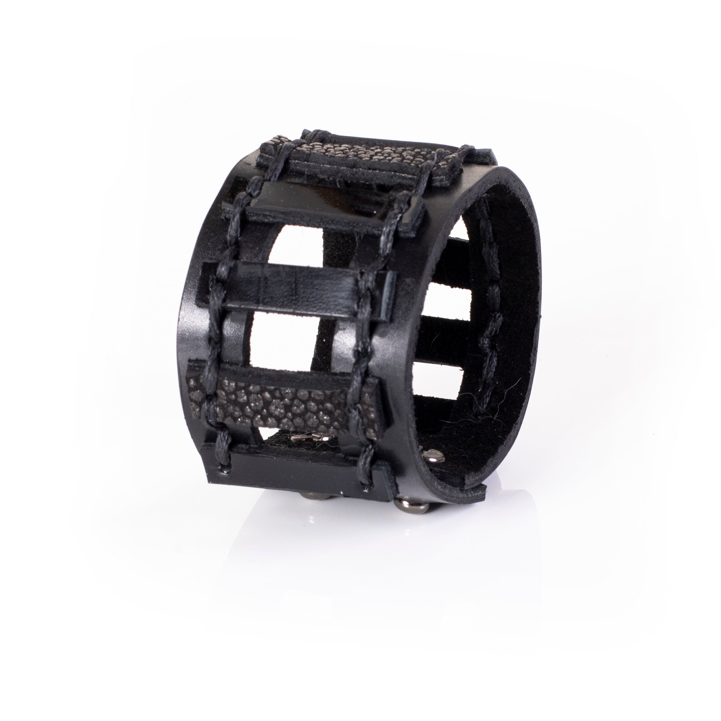 Black leather cuff bracelet with cage structure and textured strips, wide statement bracelet for women