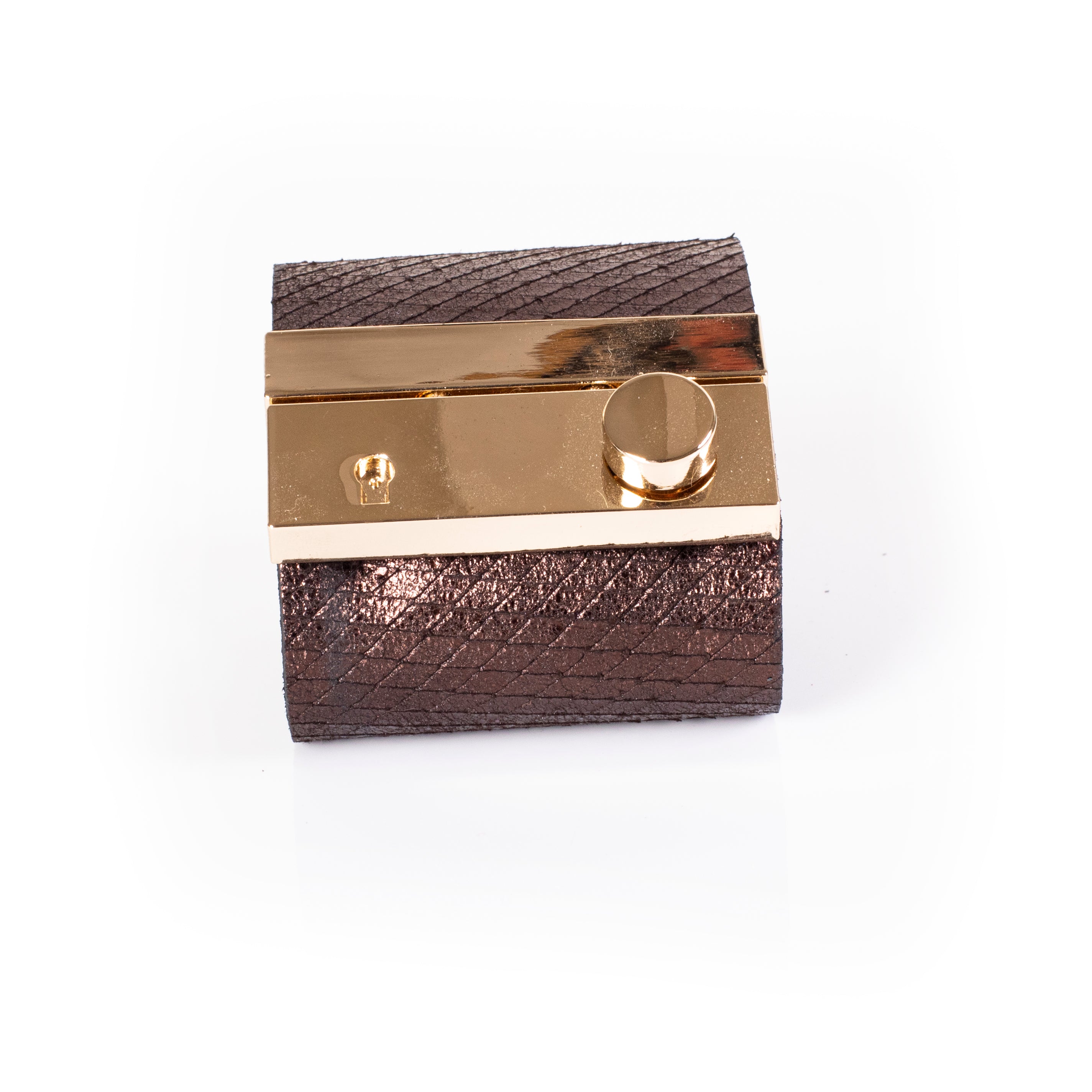 wide bronze leather cuff bracelet with polished gold plate and minimal lock detail statement design