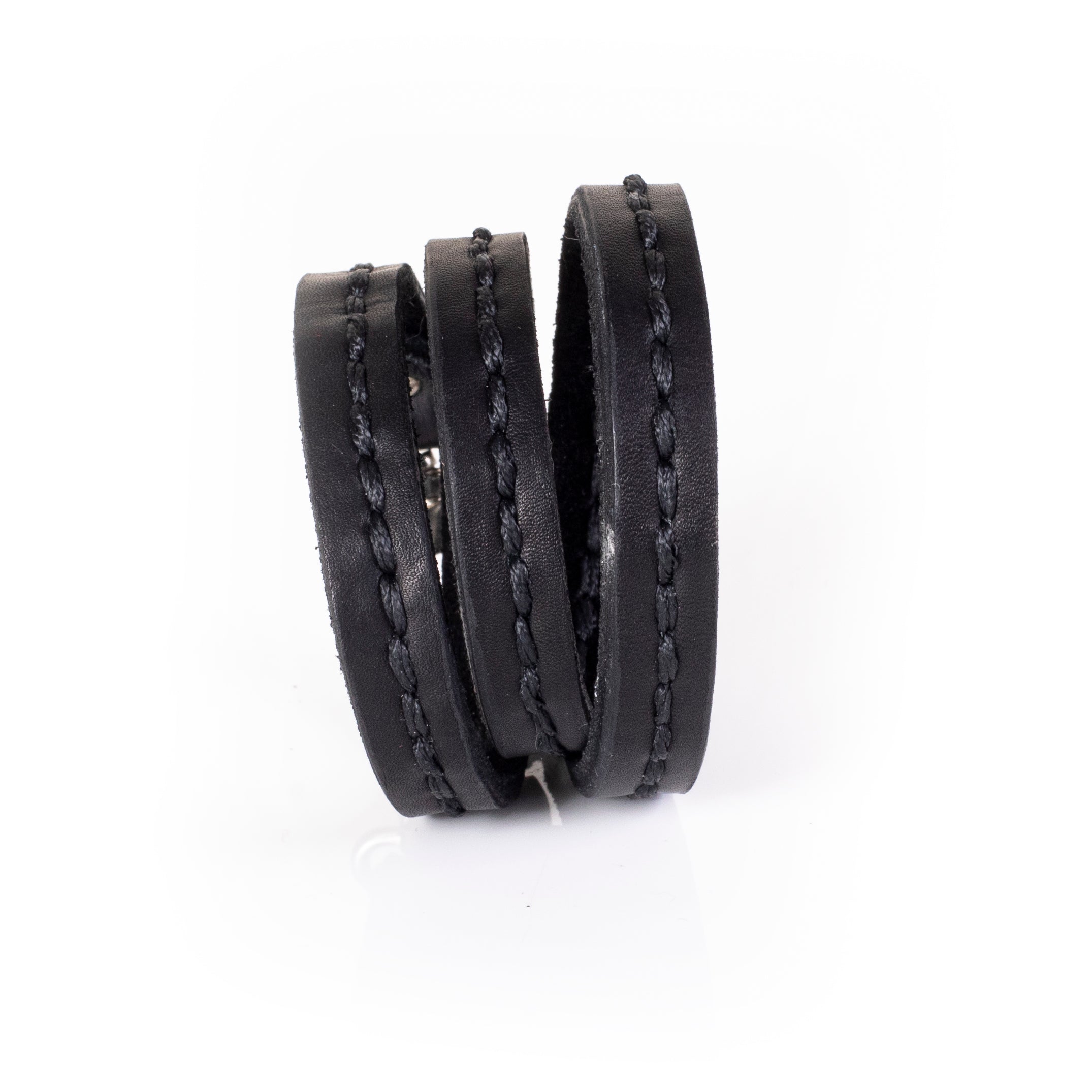 Black leather triple wrap bracelet with visible hand stitching and layered slim straps, handcrafted minimalist bracelet for women by THE DARK