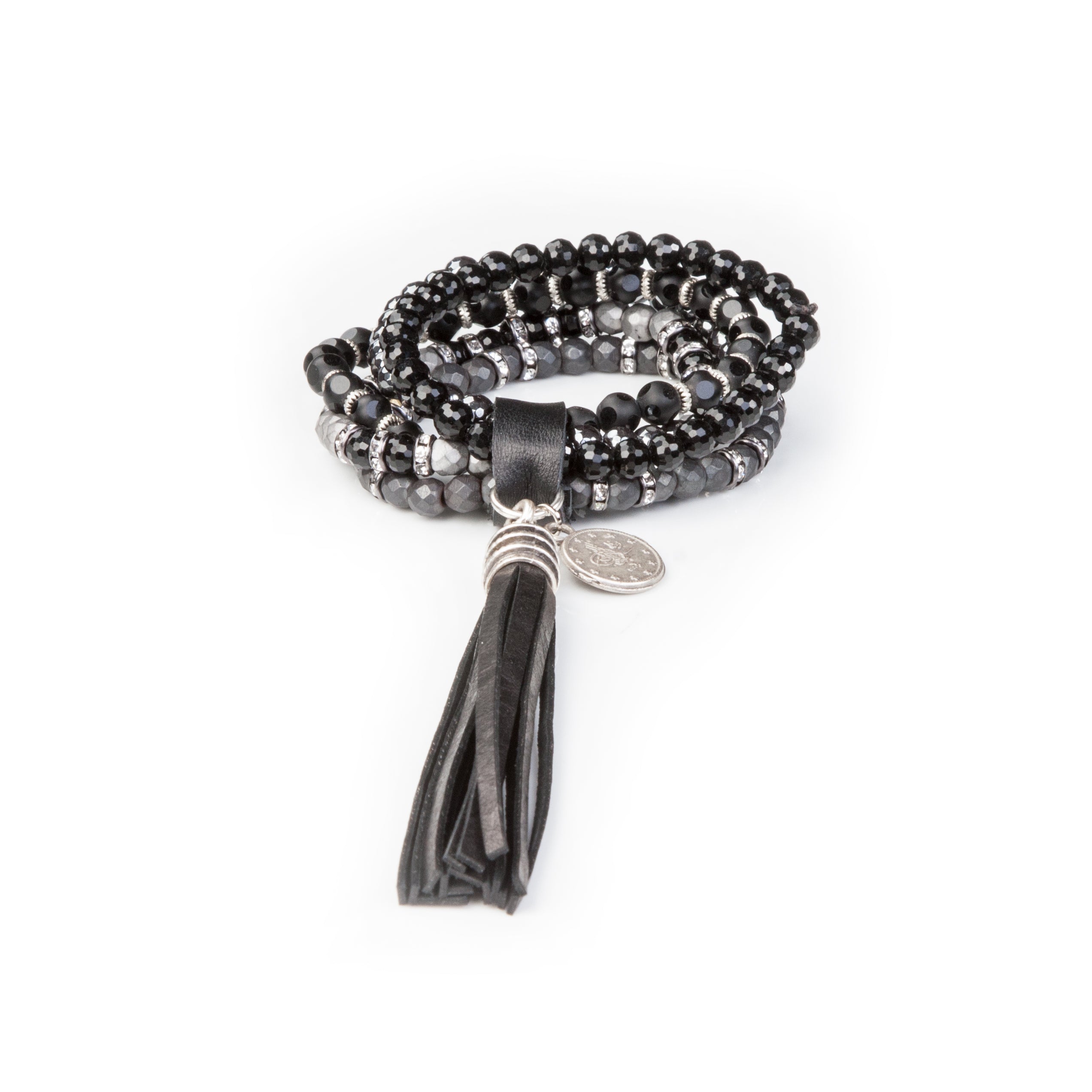 Women’s black layered crystal wrap bracelet with smoky gray bead accents, silver details, and oversized black leather tassel on white background