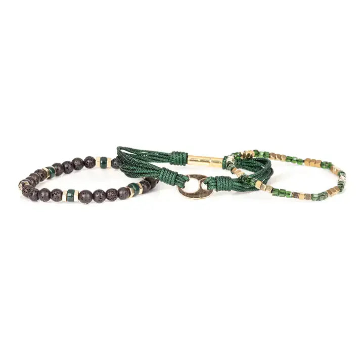 Men’s layered bracelet set featuring dark green braided cord, green crystal beads, gold-tone geometric spacer beads, matte black lava stone beads, and a polished gold-tone centerpiece, stacked in a refined green and gold luxury design on a white background.