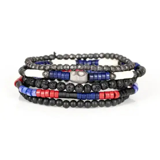 Black multi-layer men’s bracelet featuring lava stone beads, faceted hematite beads, blue cylindrical accents, red and white spacer details, and layered black bead strands on a light background.