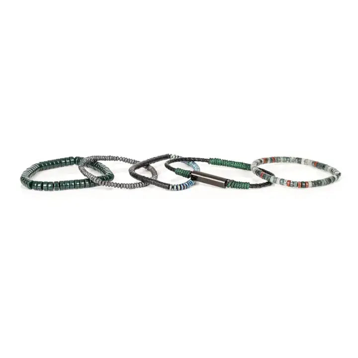 Men’s layered bracelet set featuring dark green heishi beads, green woven cord, black braided leather, hematite spacer beads, and green-gray natural stone beads with subtle red accents, stacked in a sophisticated earthy luxury design on a white background.