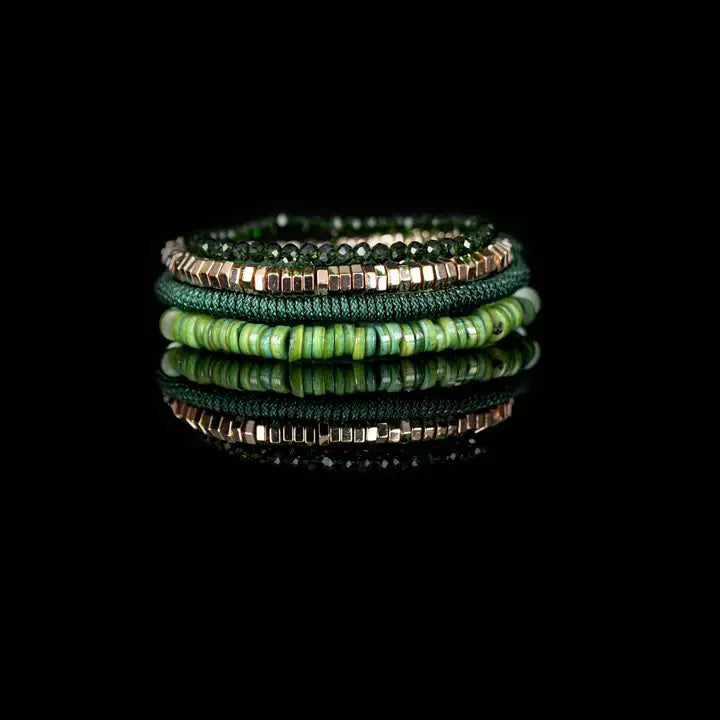 Green multi-layer men’s bracelet set featuring faceted green crystal beads, gold hematite cube beads, braided green rope, and layered green natural stone disc beads on a light background.