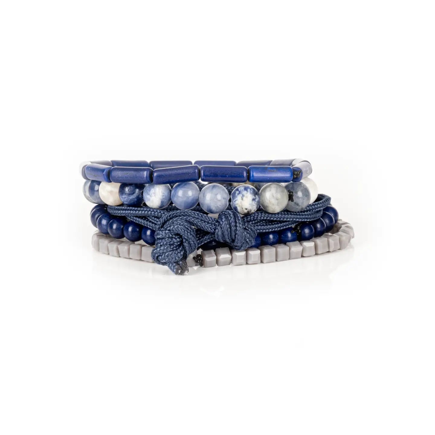 Men’s layered bracelet set featuring deep blue lapis-style beads, blue and white marbled natural stone beads, navy braided cord wraps, matte blue round beads, and light gray geometric heishi beads, stacked in a sophisticated nautical-inspired luxury design on a white background.