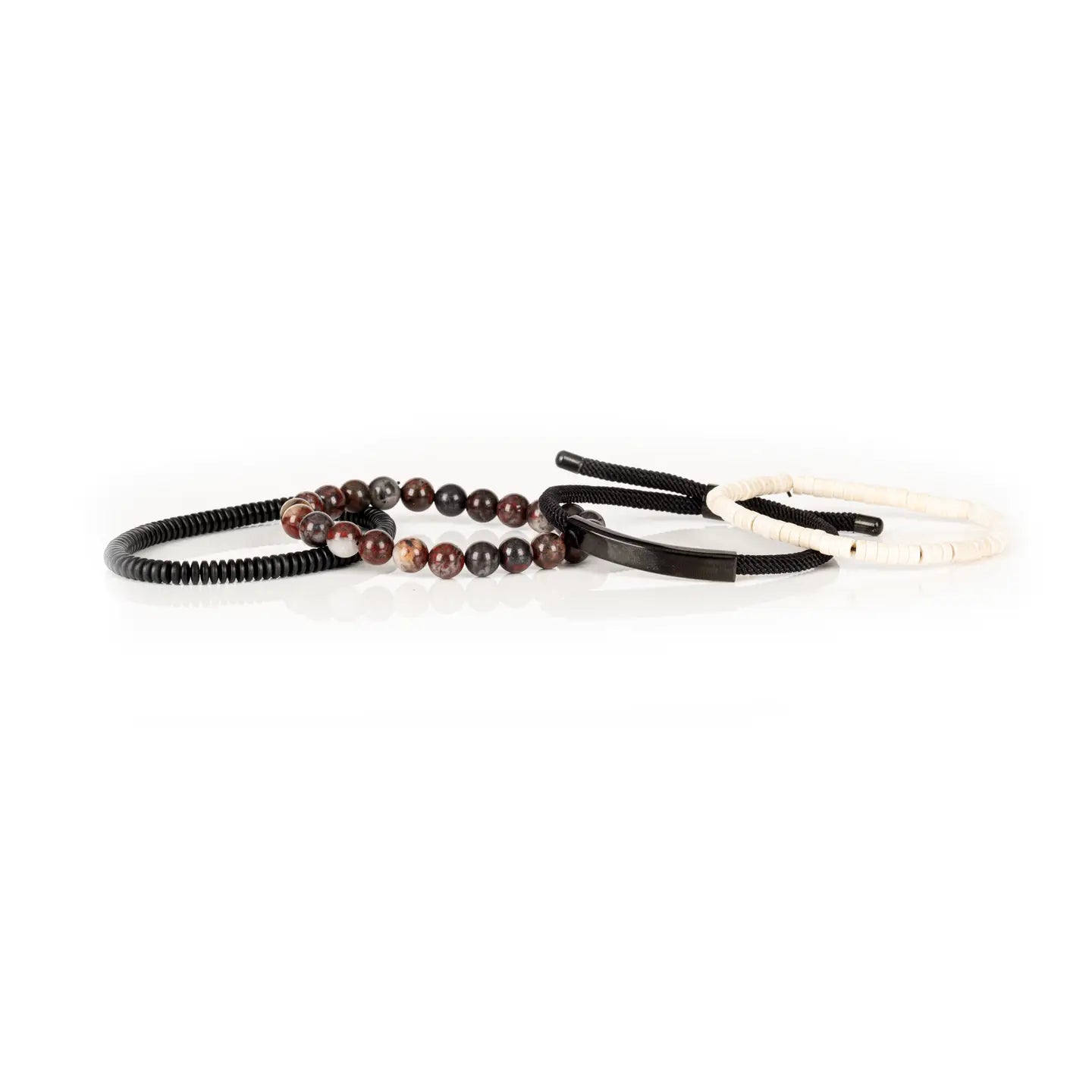 Men’s layered bracelet set featuring white howlite heishi beads, a gunmetal ID bar centerpiece, black braided cord wraps, red and black natural stone beads, and black coil wrap accents, stacked in a bold contemporary luxury design on a white background.