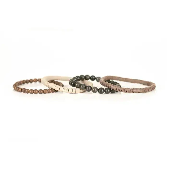 Earth-tone multi-layer men’s bracelet set featuring natural stone beads, matte beige disc beads, bronze bead strand, and layered neutral textures on a light background.