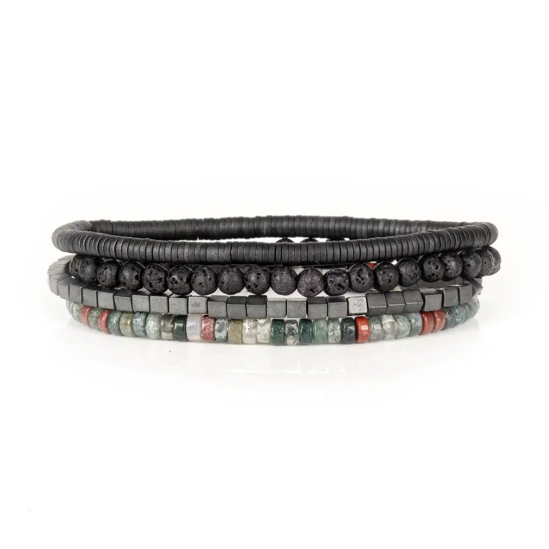 Men's layered bracelet set featuring matte black lava stone beads, hematite cube beads, and multi-color natural stone heishi beads in green, grey, and rust tones arranged in a stacked design on a white background.