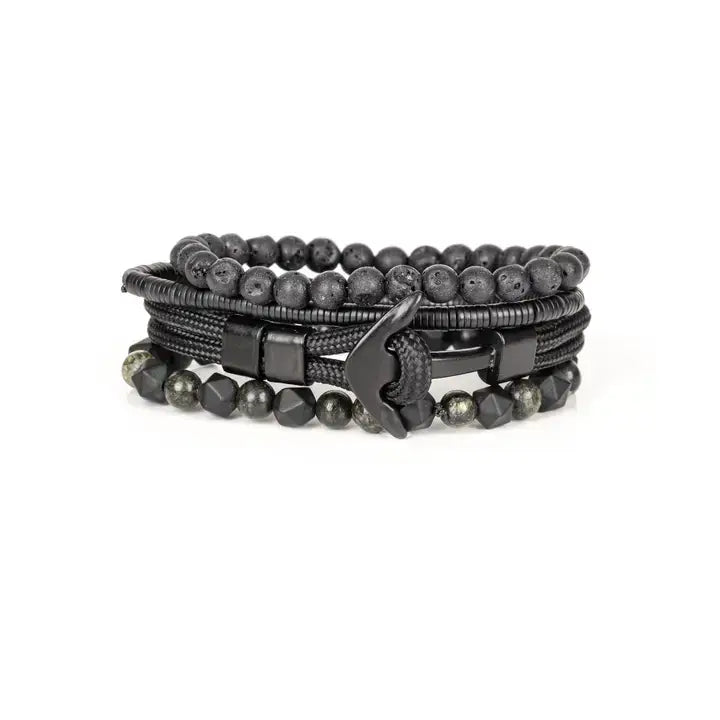 Black multi-layer men’s bracelet set featuring lava stone beads, faceted black onyx stones, braided rope layers, and layered metallic spacer accents on a light background.