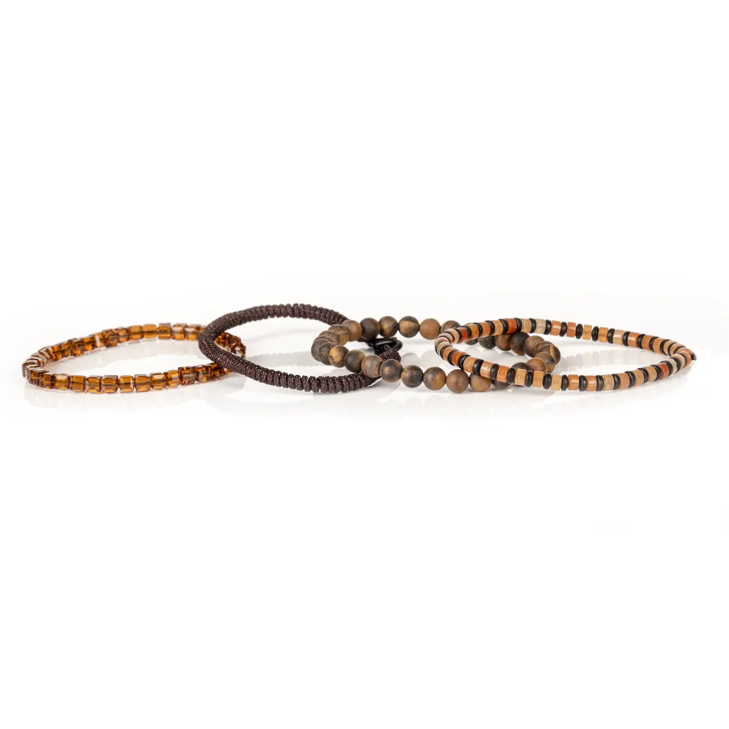 Men's layered bracelet set featuring genuine Tiger Eye stone beads, amber crystal accents, earth-tone heishi beads, and brown woven cord details arranged in a stacked design on a white background.