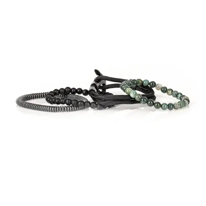 Green and black multi-layer men’s bracelet featuring natural green stone beads, braided black rope layers, matte black onyx beads, and gunmetal hematite disc strands on a light background.