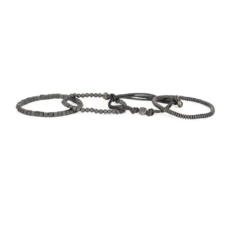 Black layered men’s bracelet set with lava stone beads, cube spacer beads, braided rope wraps, and pavé square centerpiece on white background.