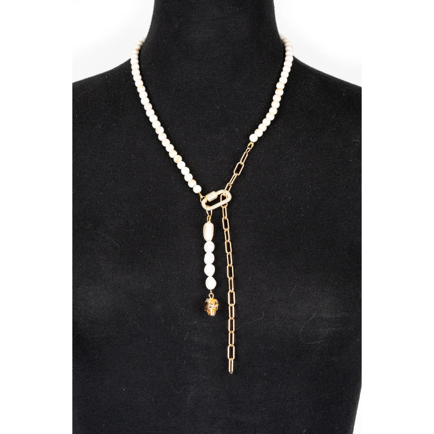 Pearl necklace with gold chain drop detail and crystal accent on white background.