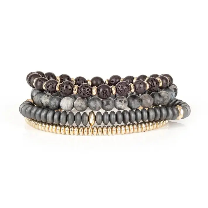 Grey multi-layer men’s bracelet set featuring lava stone beads, marble grey stones, matte hematite disc beads, and gold-tone metallic accents on a light background.
