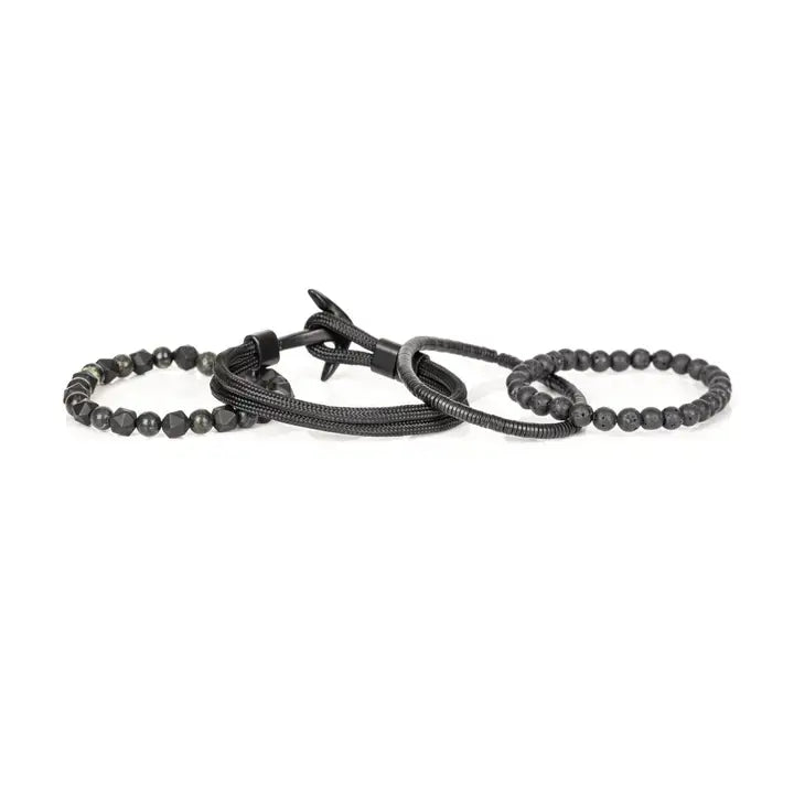 Black multi-layer men’s bracelet set featuring lava stone beads, faceted black onyx stones, braided rope layers, and layered metallic spacer accents on a light background.