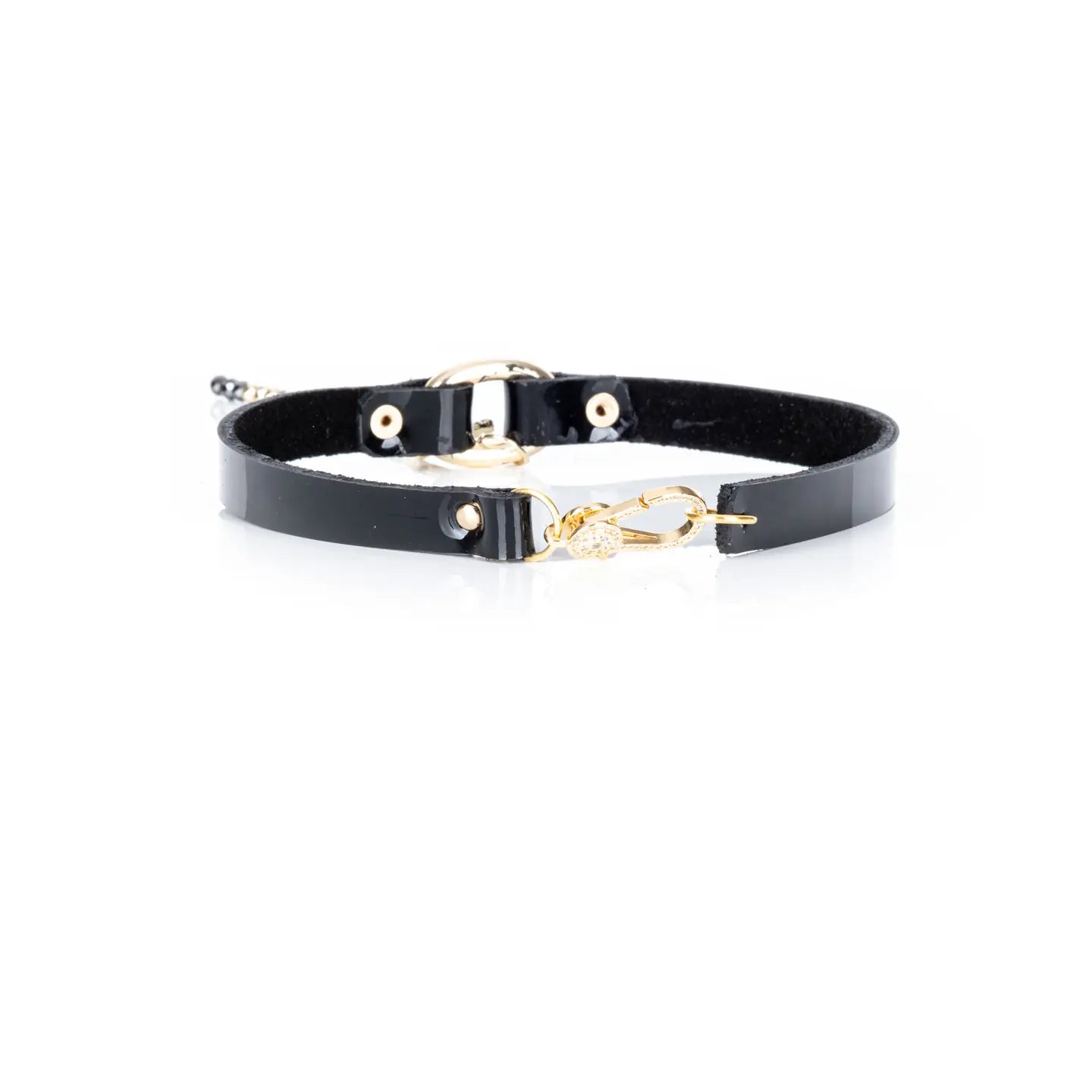 Black leather choker with a gold cross pendant and a long beaded chain drop, displayed on a white background.