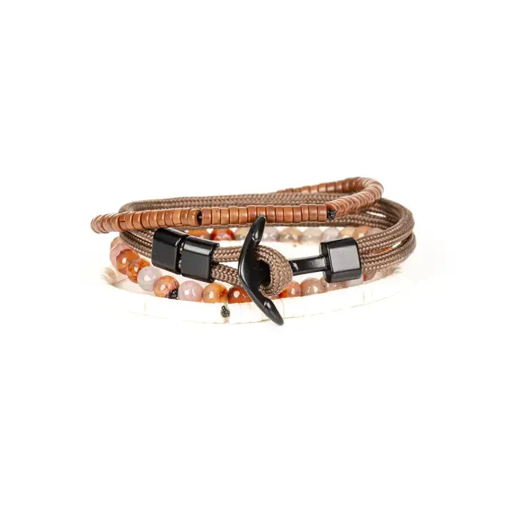 Men’s layered bracelet set featuring brown braided cord, brown heishi beads, polished black metal accents, warm-toned natural stone beads, and white heishi beads, stacked in a refined earthy luxury design on a white background.