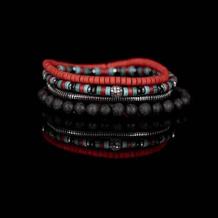 Men's layered bracelet set featuring coral red heishi beads, turquoise and black accent beads, silver-tone hematite spacers, a decorative pavé-style centerpiece bead, and matte black lava stone beads arranged in a stacked design on a white background.